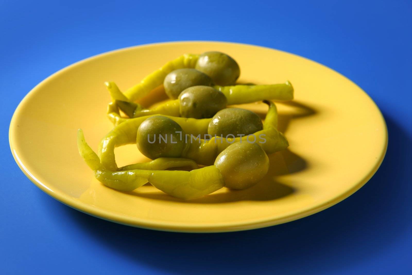Tapas from Spain, olives and hot green pepper snack