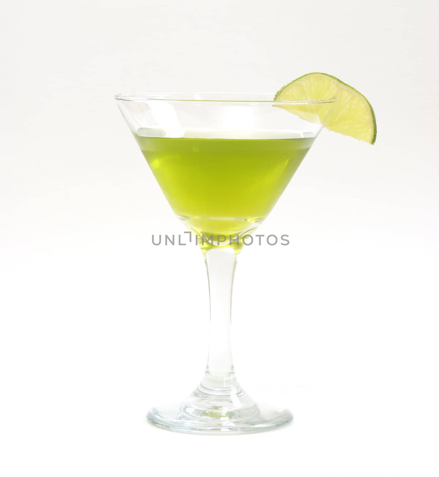 A lime beverage in a martini glass.