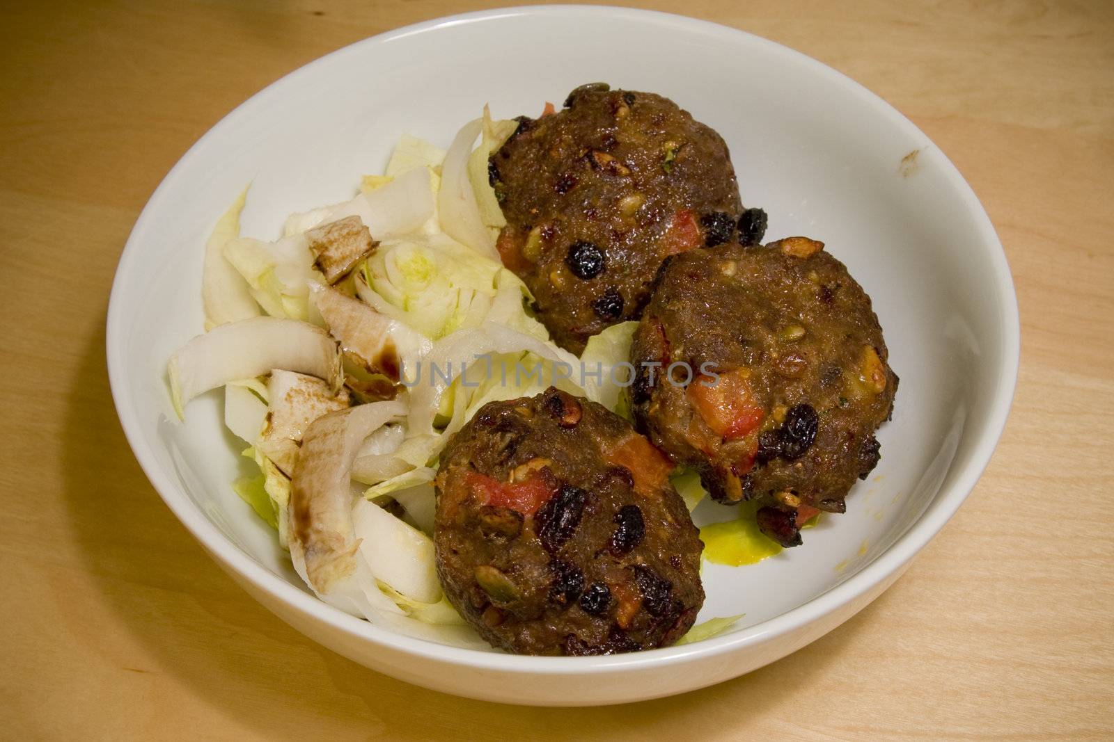 Meat balls on a bed of endives by cvail73