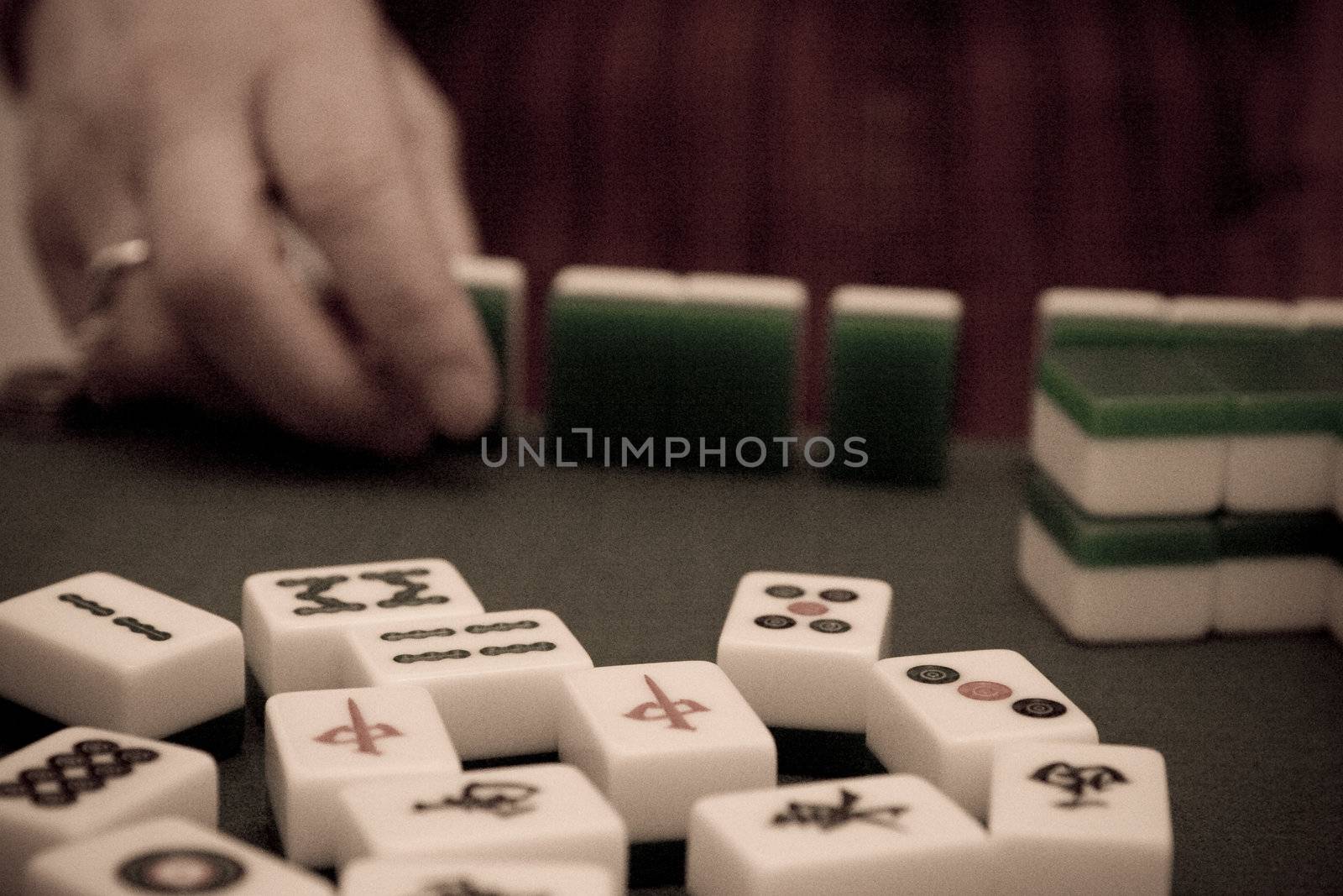 Hand arranging tiles