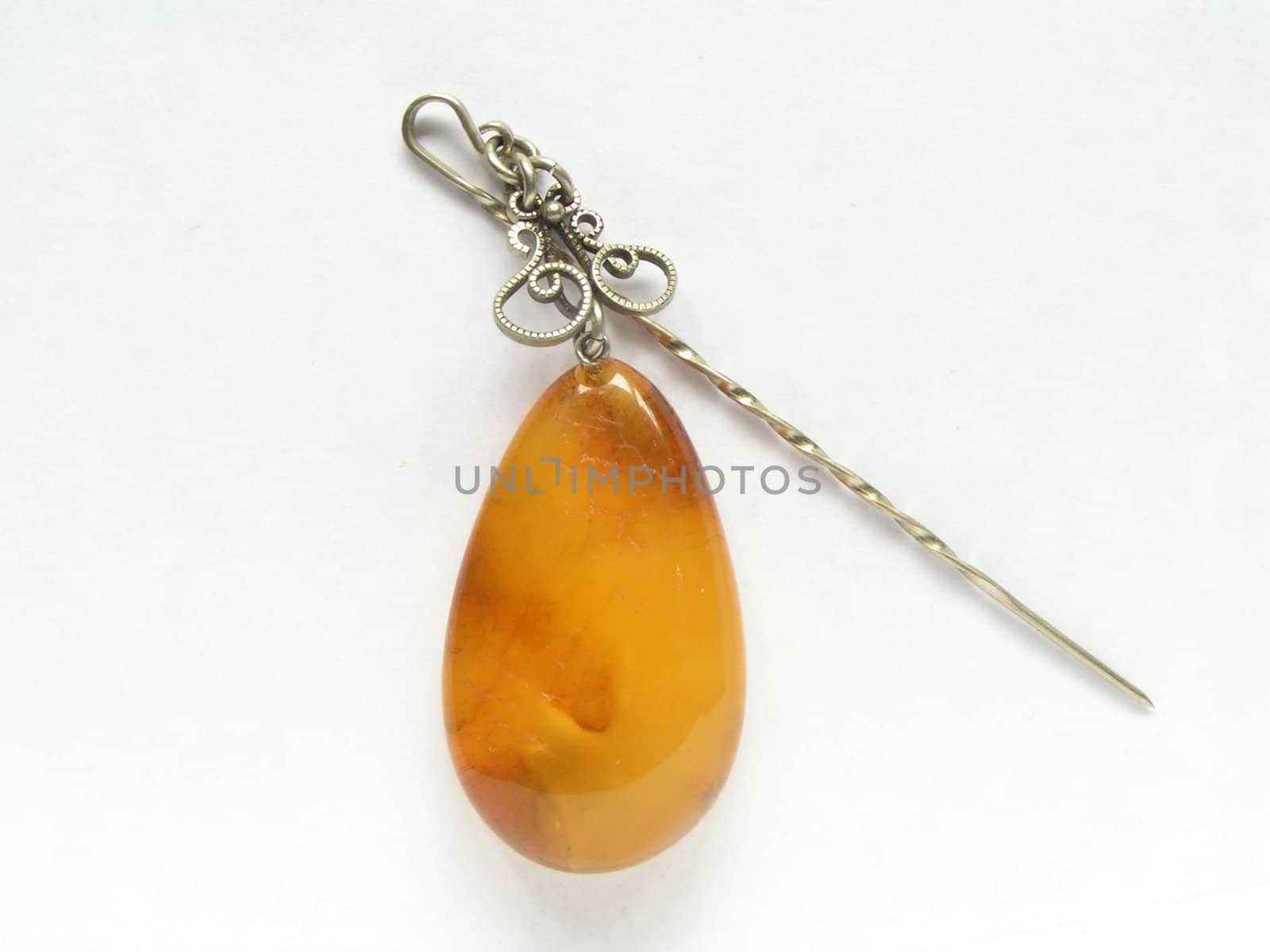 Decorative pin with amber on white background (mass market production)