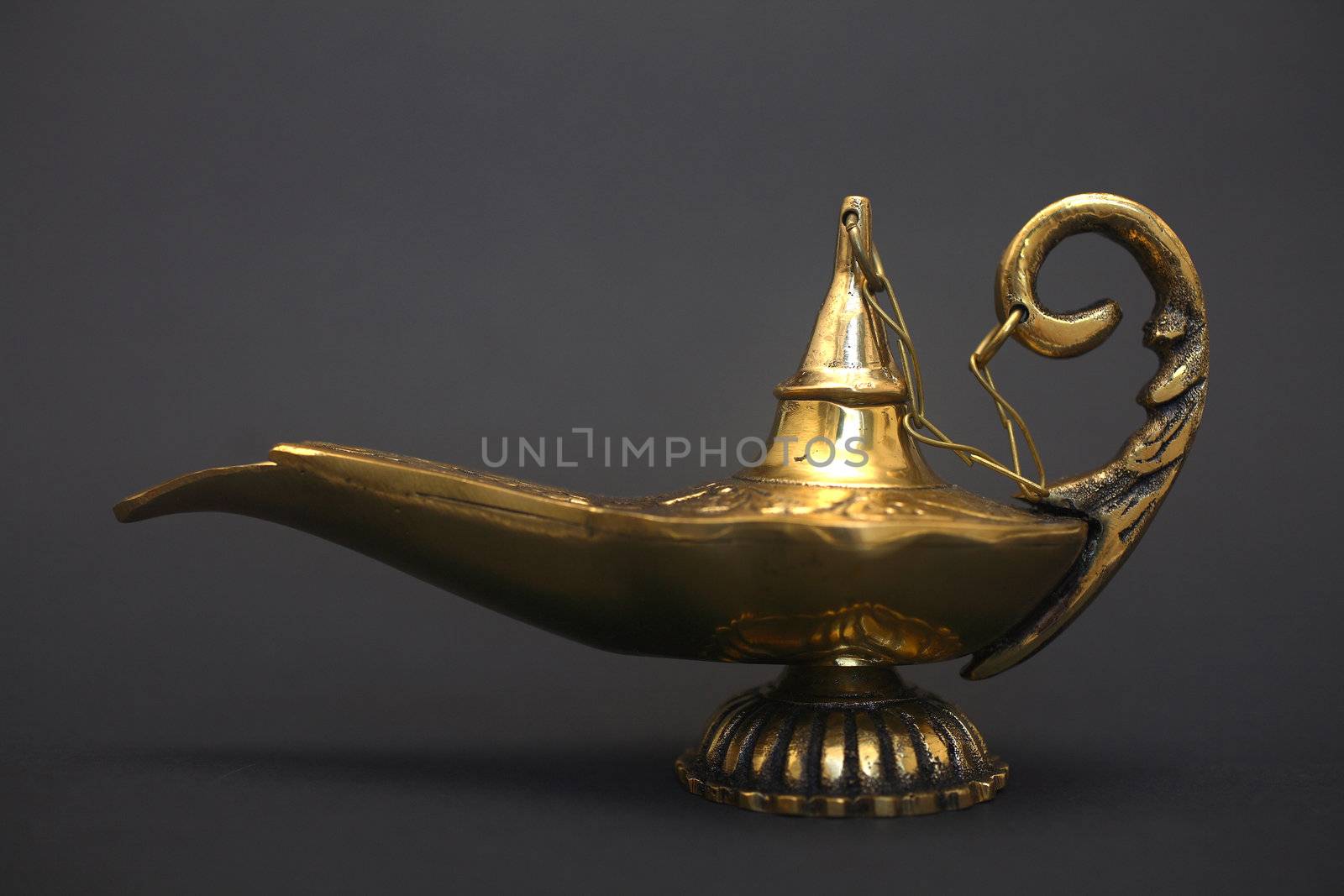 An isolated golden or bronze magic genie lamp, like Aladdins! :)