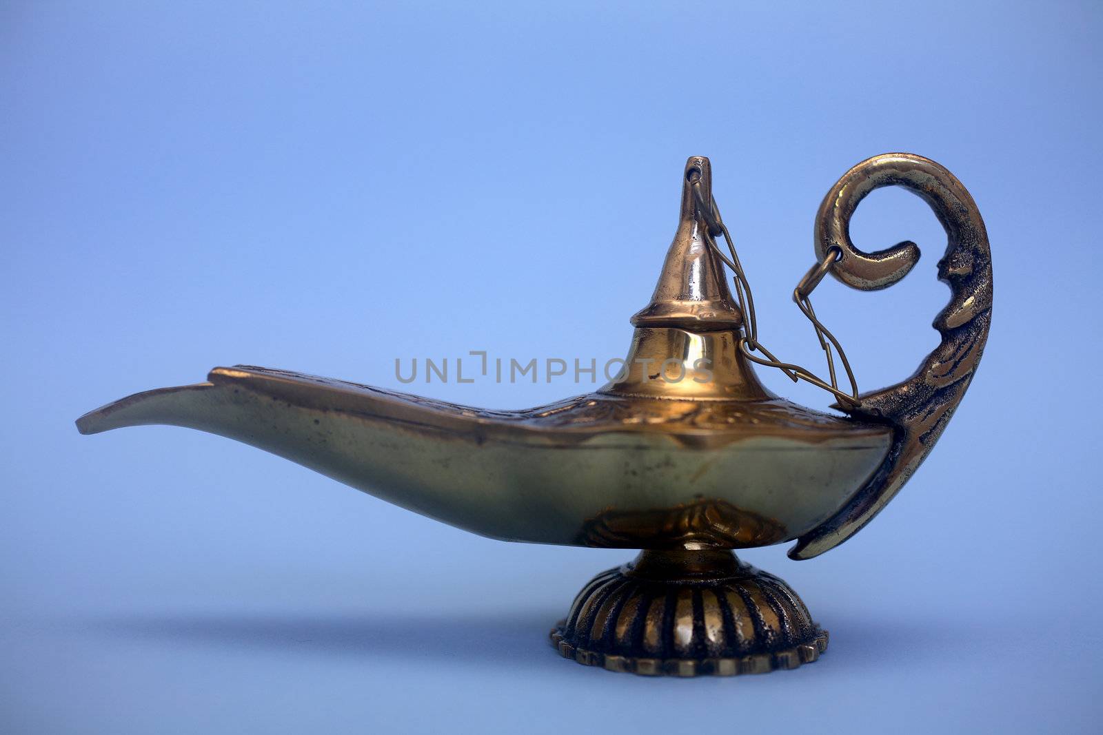 An isolated golden or bronze magic genie lamp, like Aladdins! :)