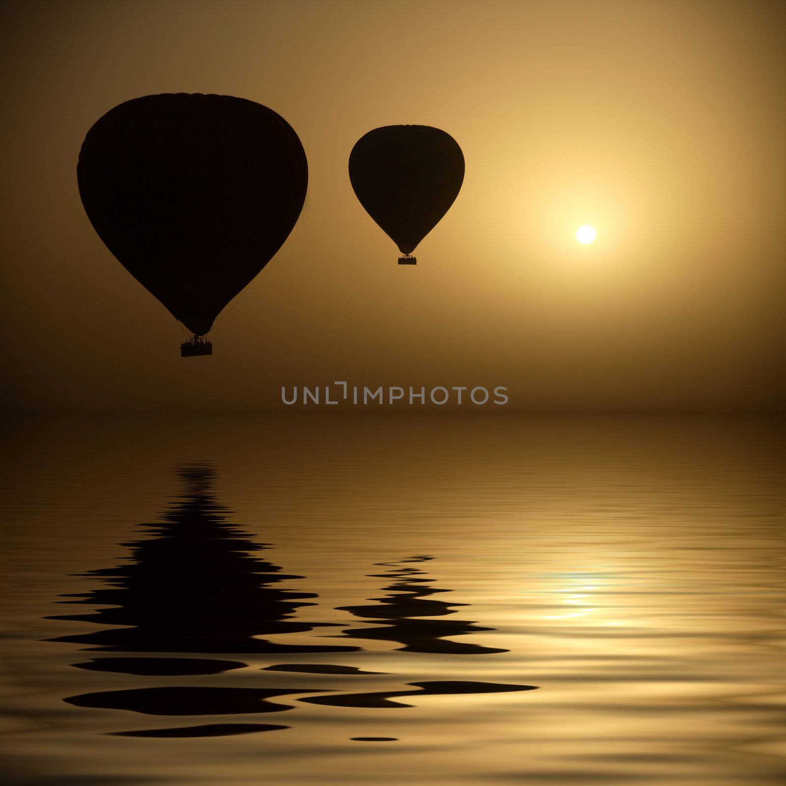 Two hot air balloon silhouettes  in the dry morning of Luxor, Egypt.

(with water reflection)