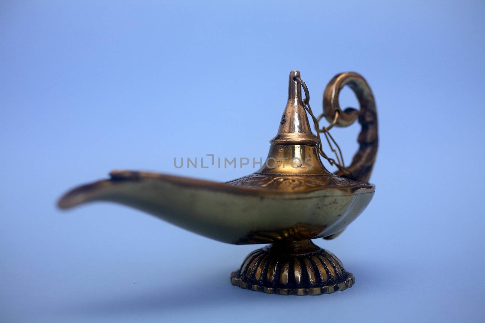 An isolated golden or bronze magic genie lamp, like Aladdins! :)