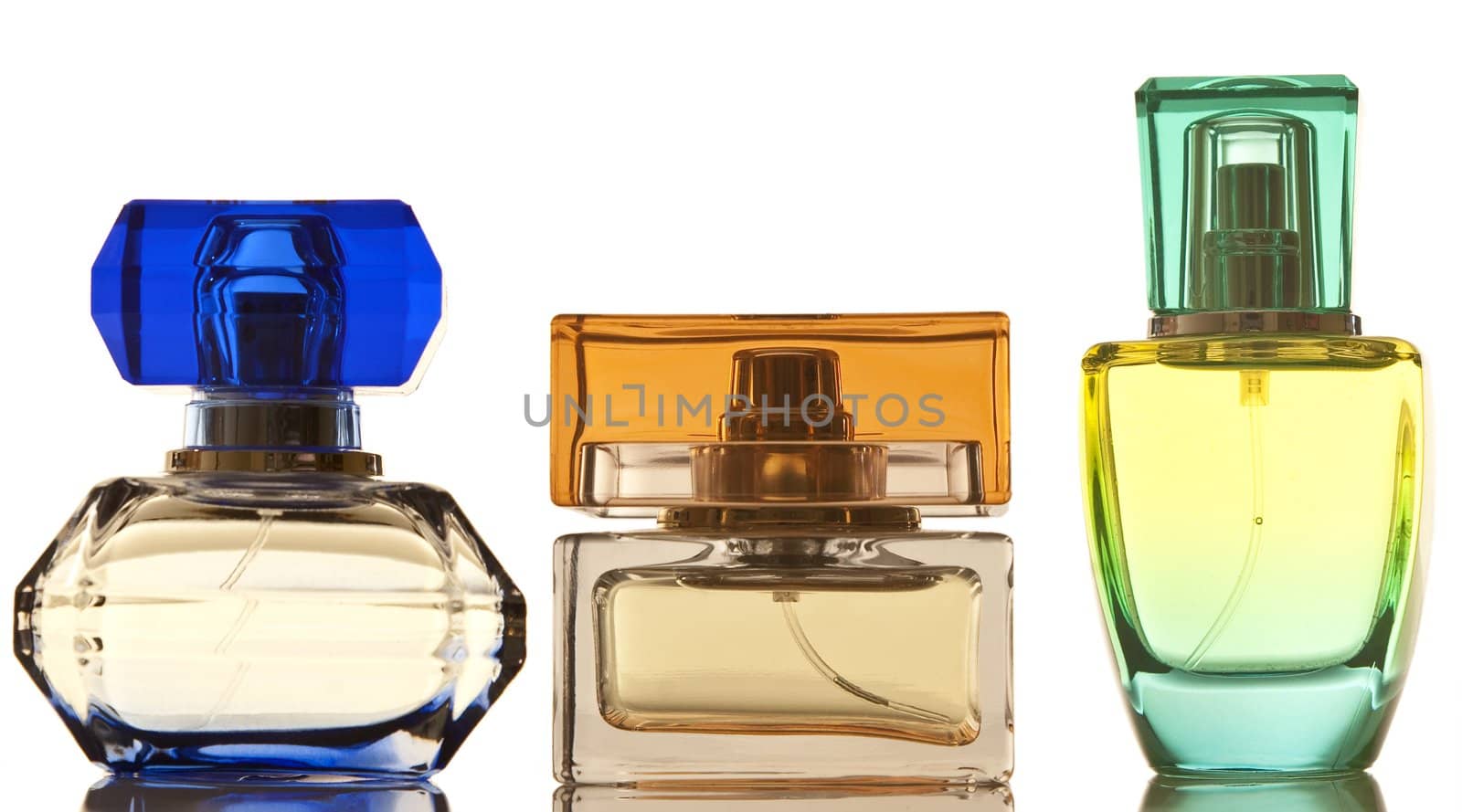 Perfume in a glass bottles on white background