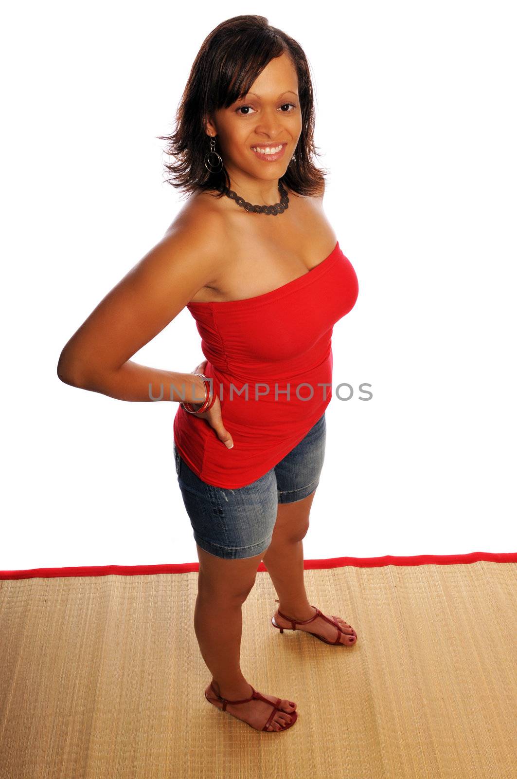 an attractive young woman on a wooden mat set on a white background