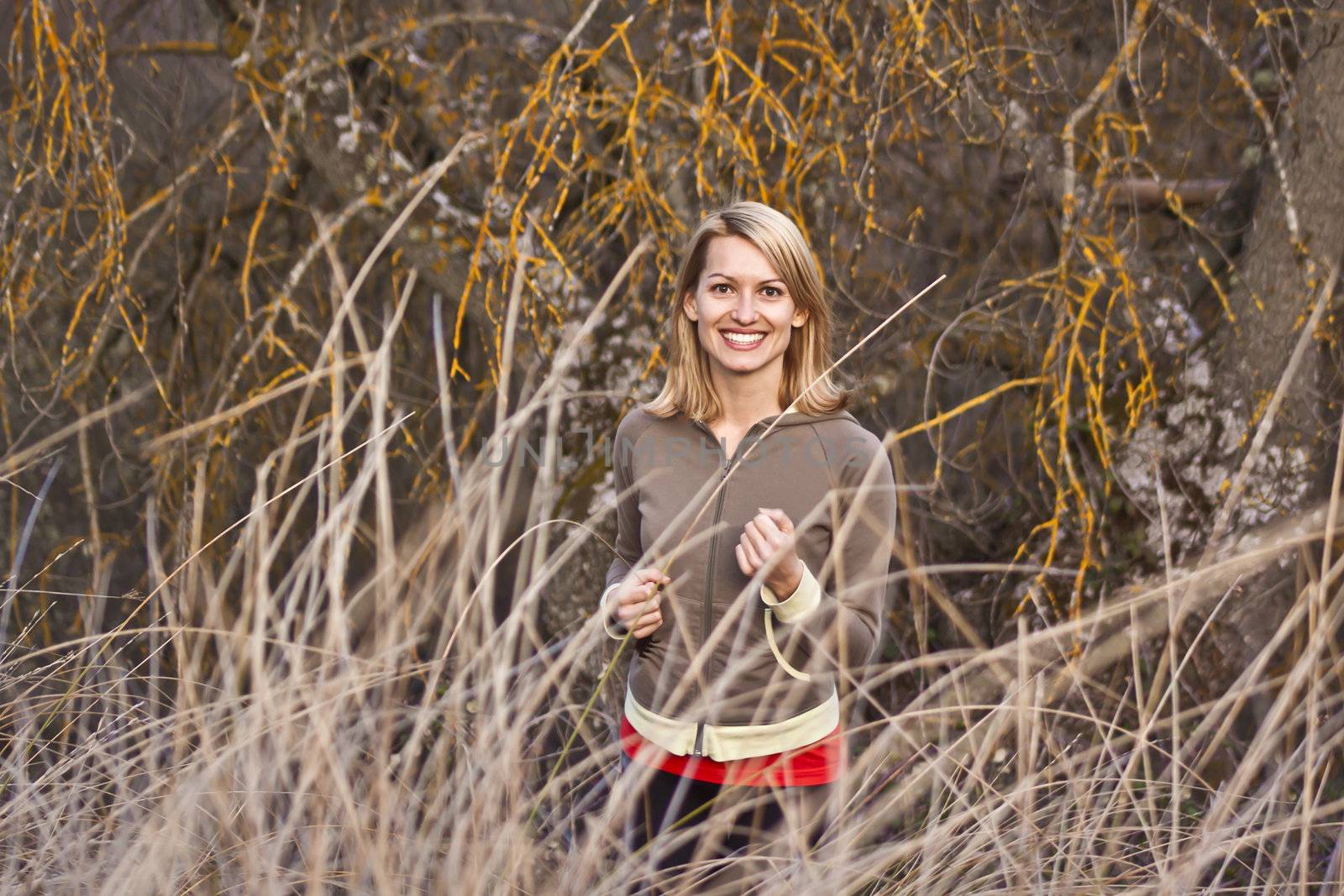 Young beautiful girl running in the autumn environment.