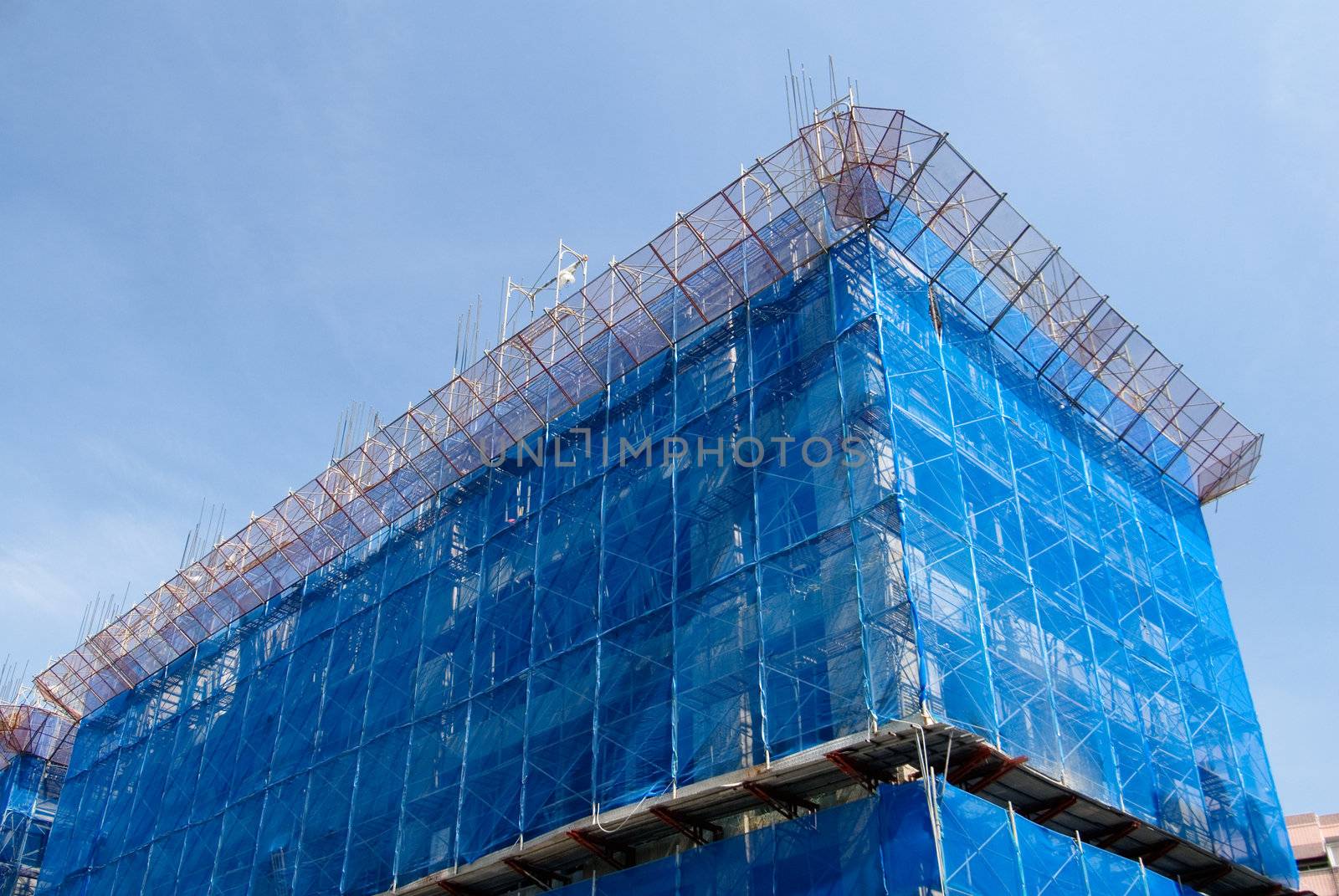 It is a blue building that under construction.