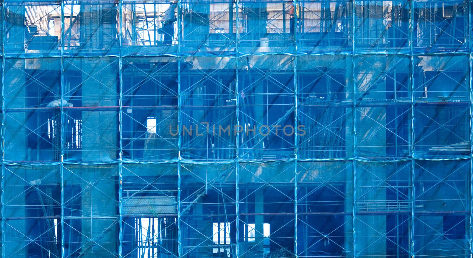 It is a blue building that under construction.