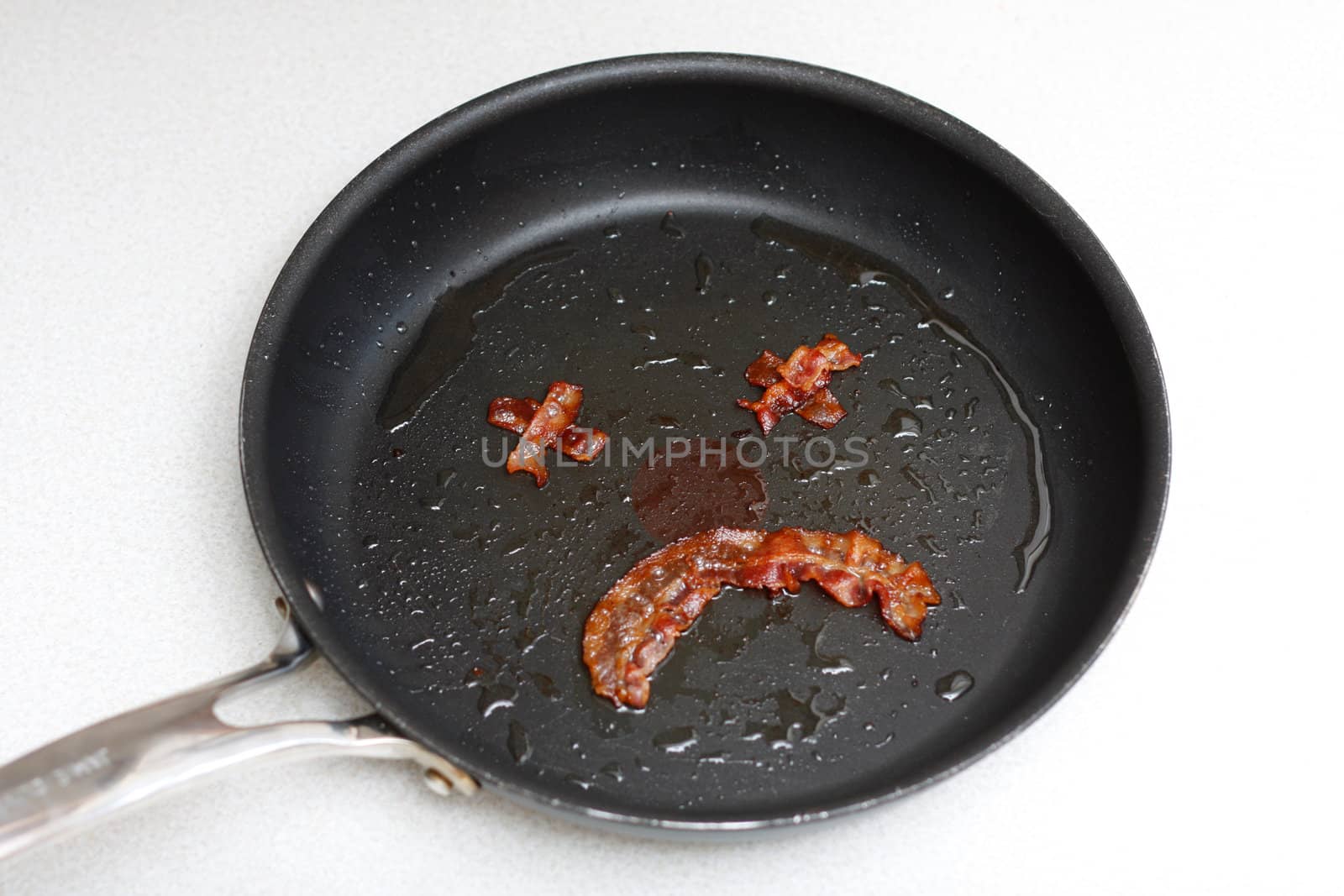 Smiley made out of bacon illustrating dangerous eating habits