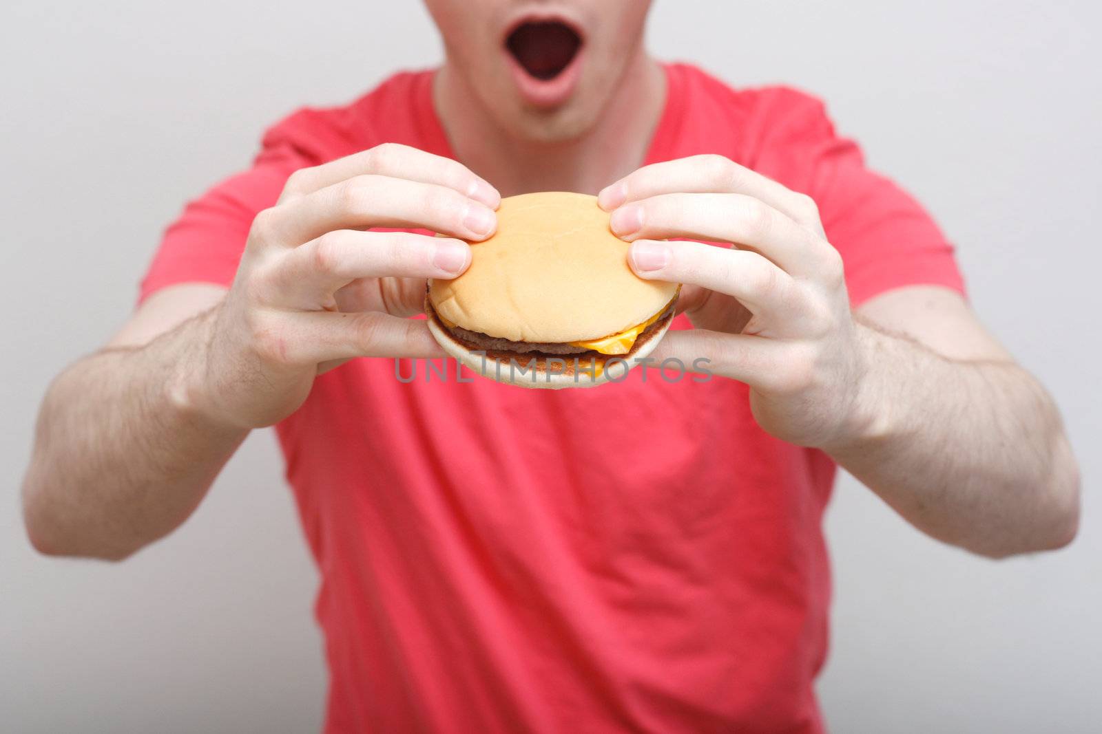 Man eating burger by leeser