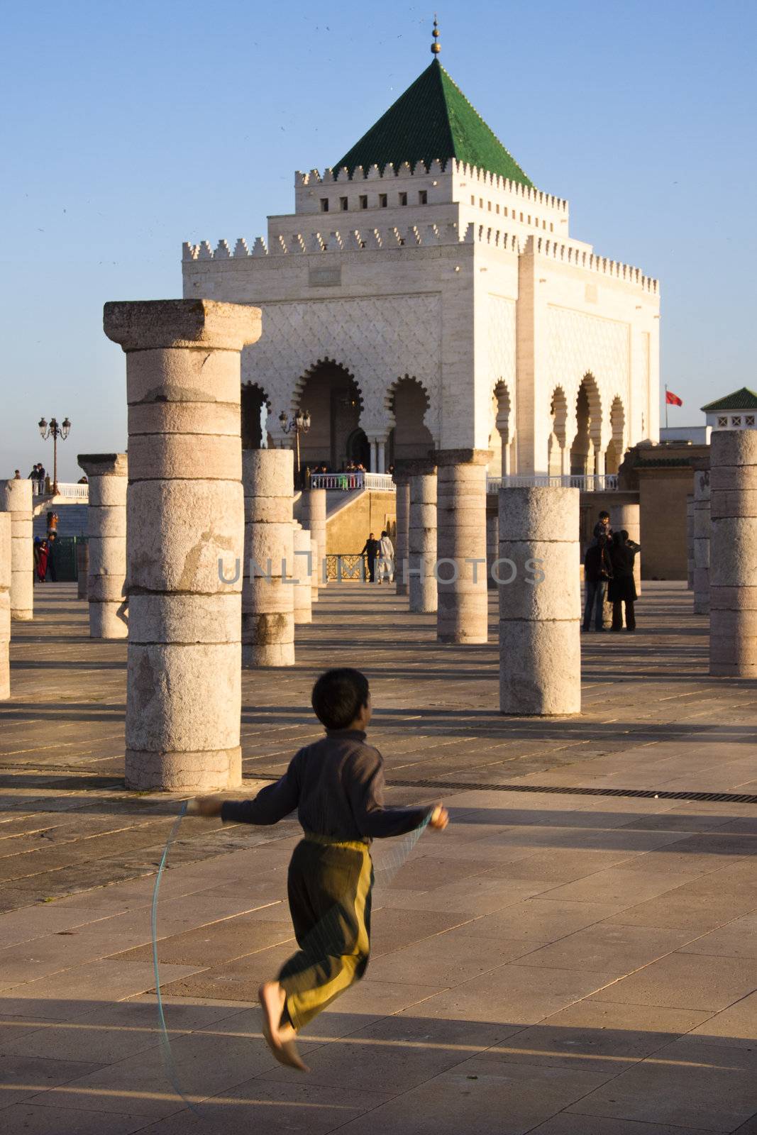 Child playing in front of Mausoleum of Mohammed V