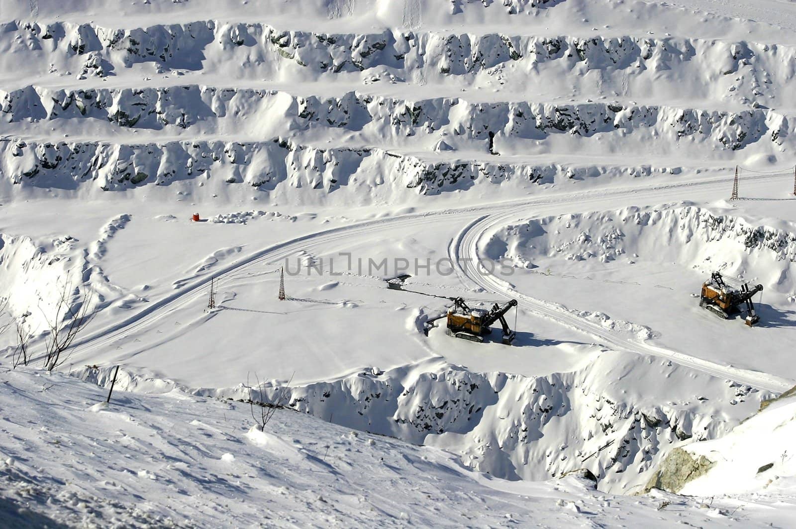 Loader in open mine shaft in winter