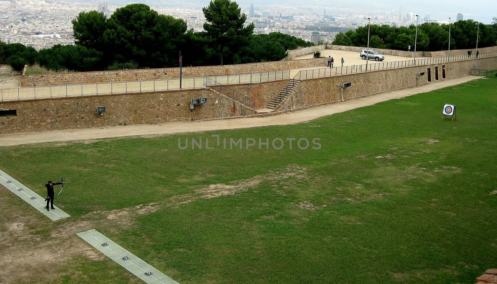 Lone archer practicing his craft in Barcelona park