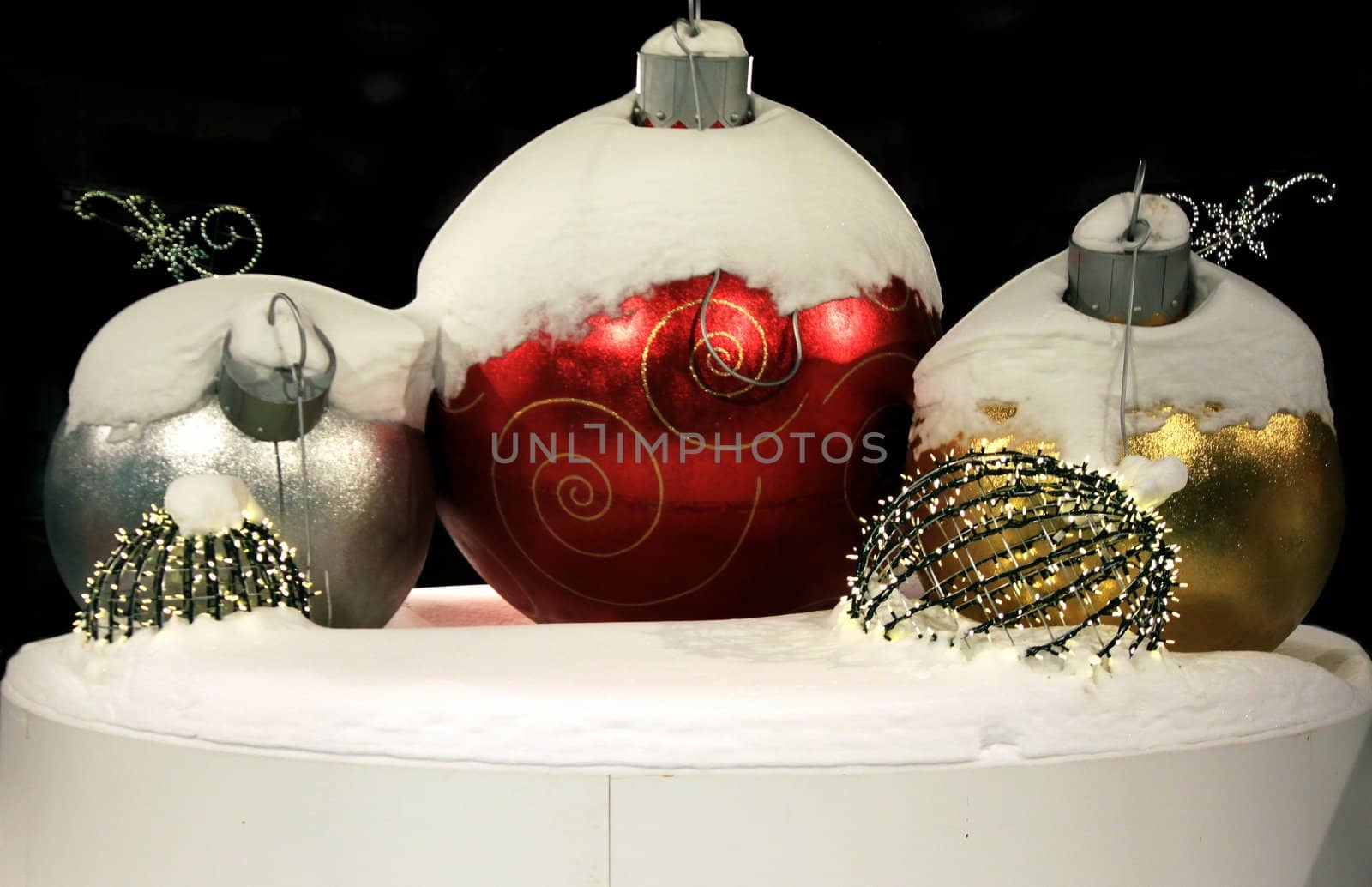 Snow covered Christmas decorations on display