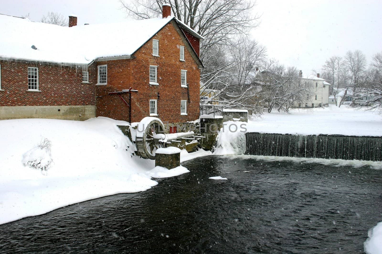Old mill along river bank
