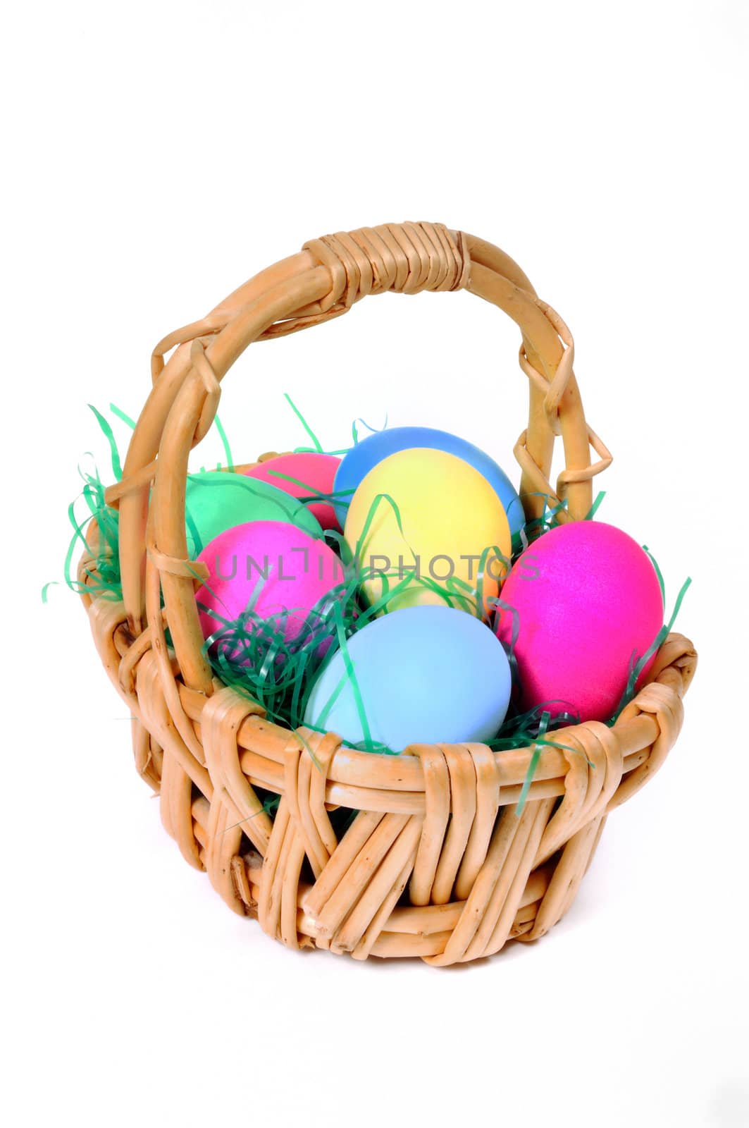 Easter colored eggs in the basket on the white background  by lobzik