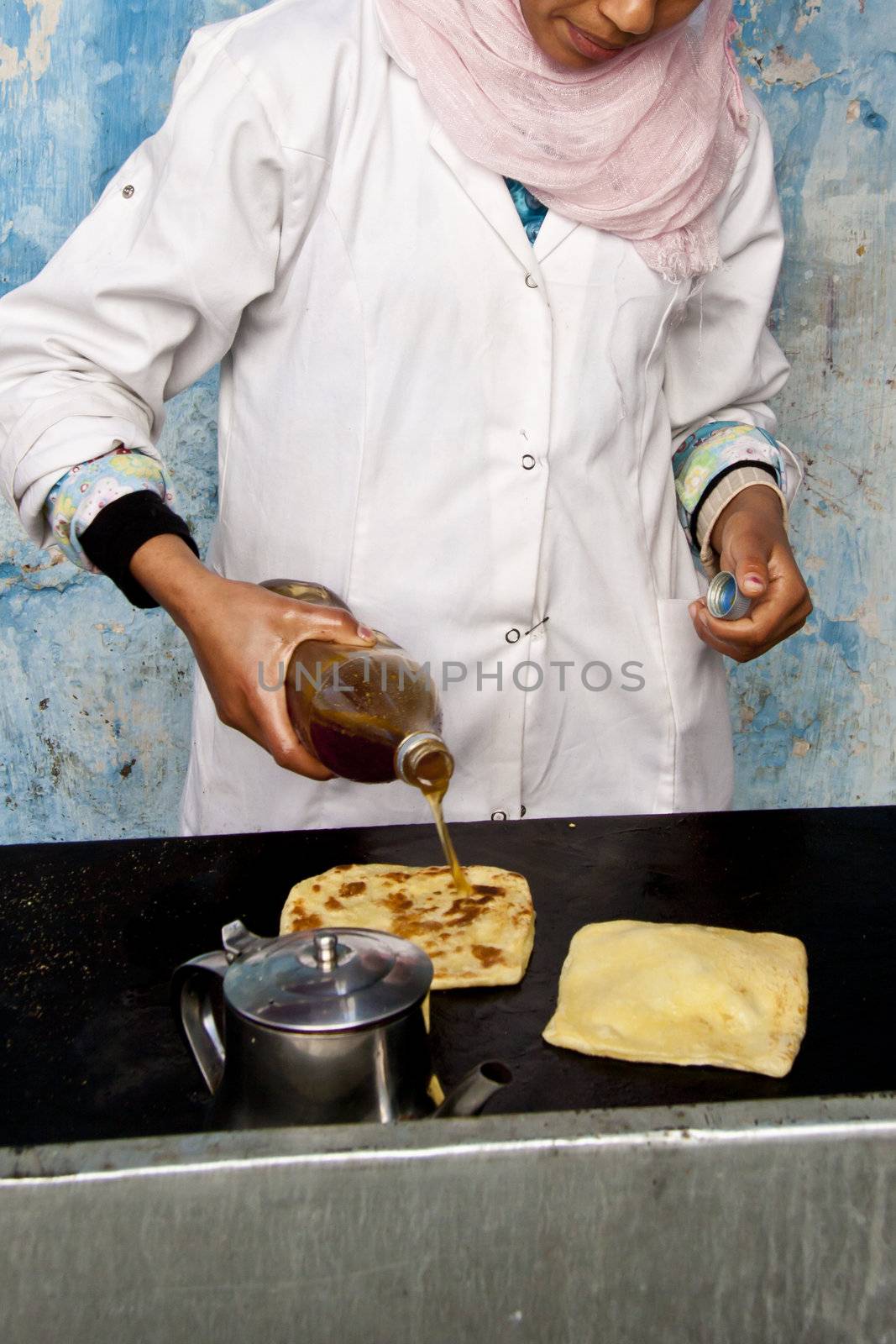 Baking traditional moroccan pancakes by kasto