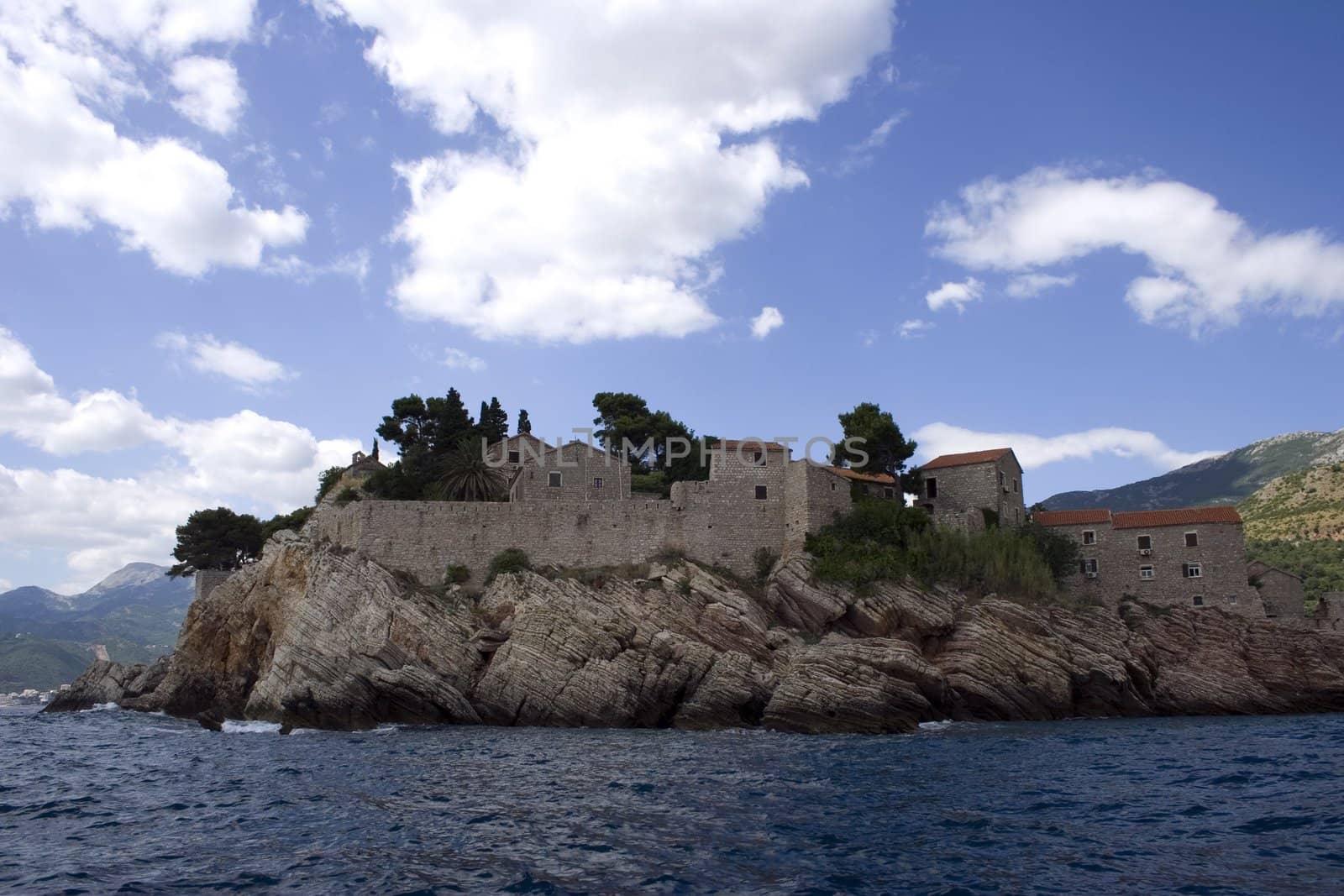 A stony island in mediterrian sea with a st.stefan church in montenegro