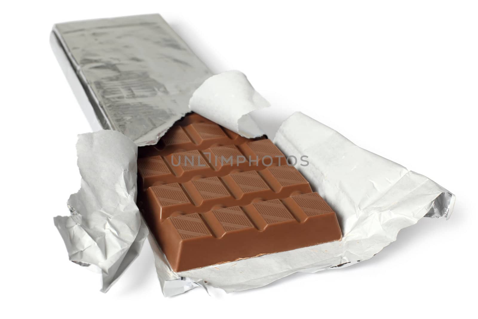 A photo of a large bar of milk chocolate. Shallow depth of field, focusing on the top of the first row. Clipping path included.