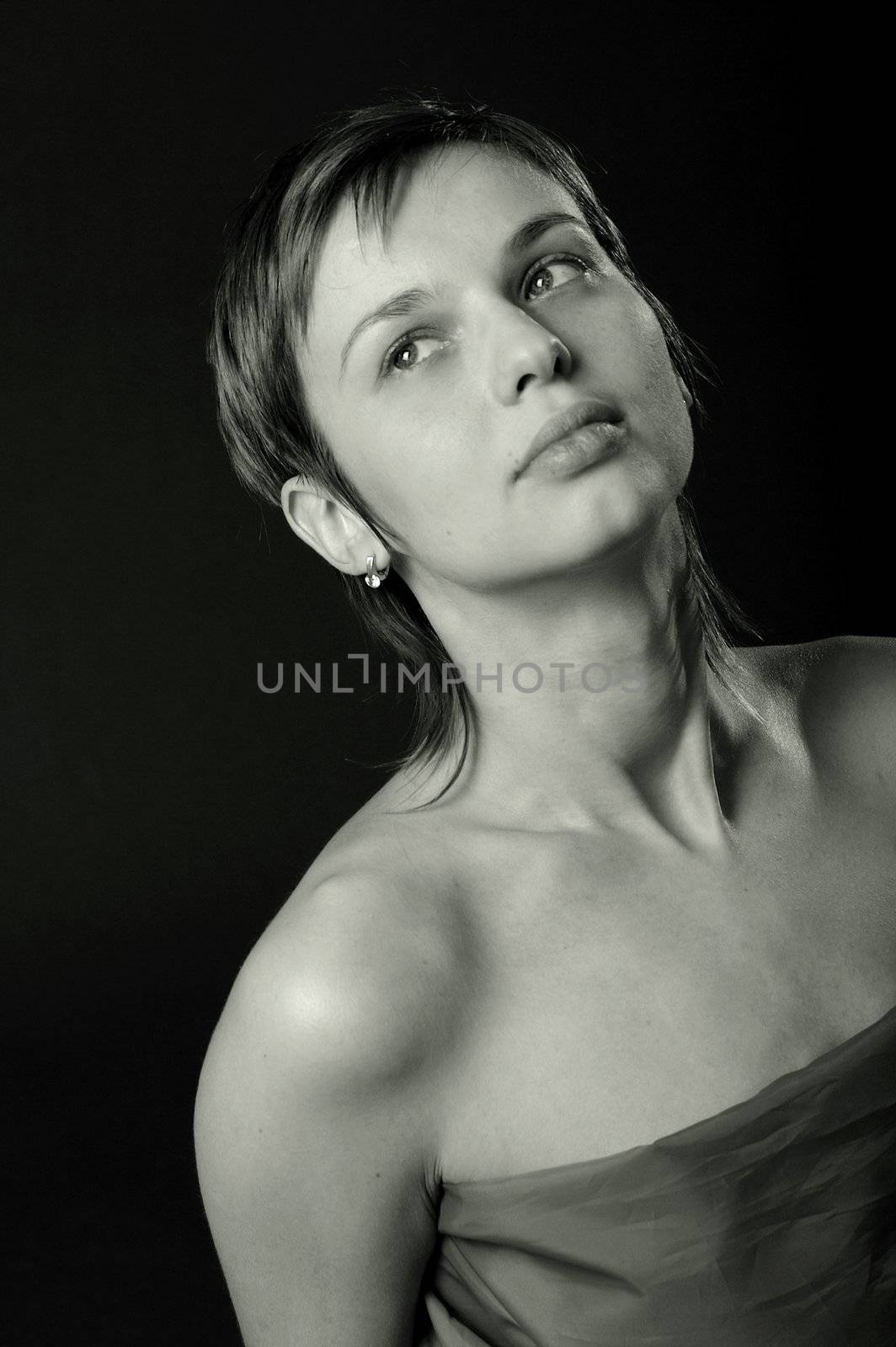 Nice portrait of dreaming woman with a smooth skin