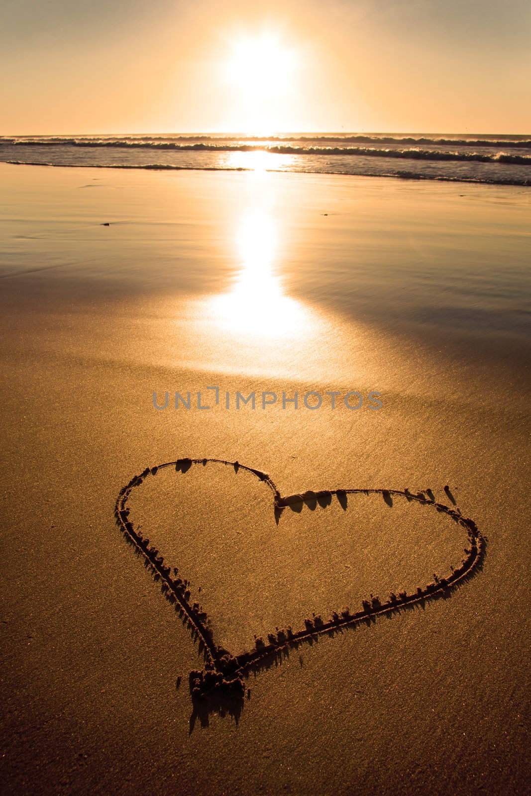 Child picture drawn in the sand on the atlantic coast