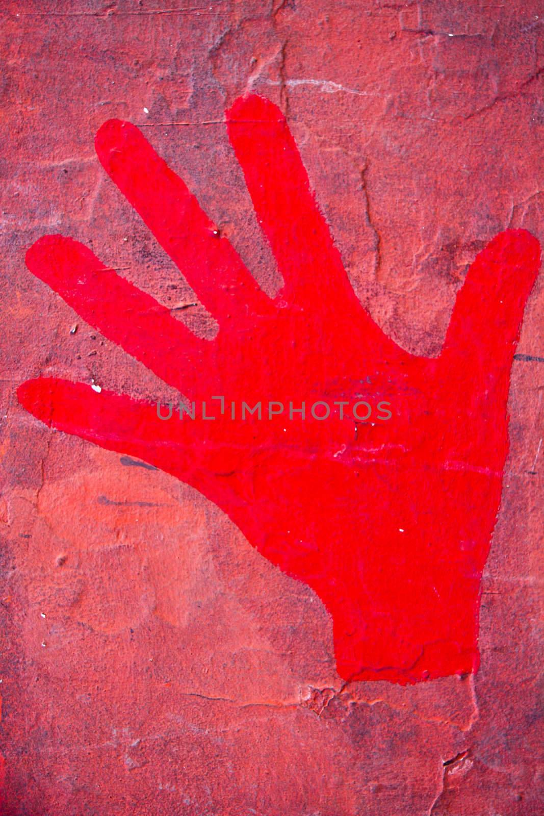 Red hand print on the  red wall.