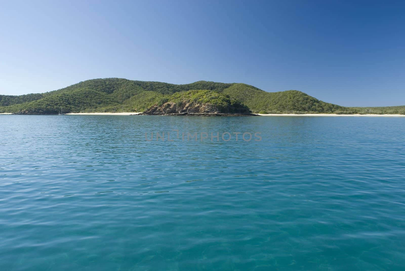 A lone yacht moored off great keppel island, queensland, australia