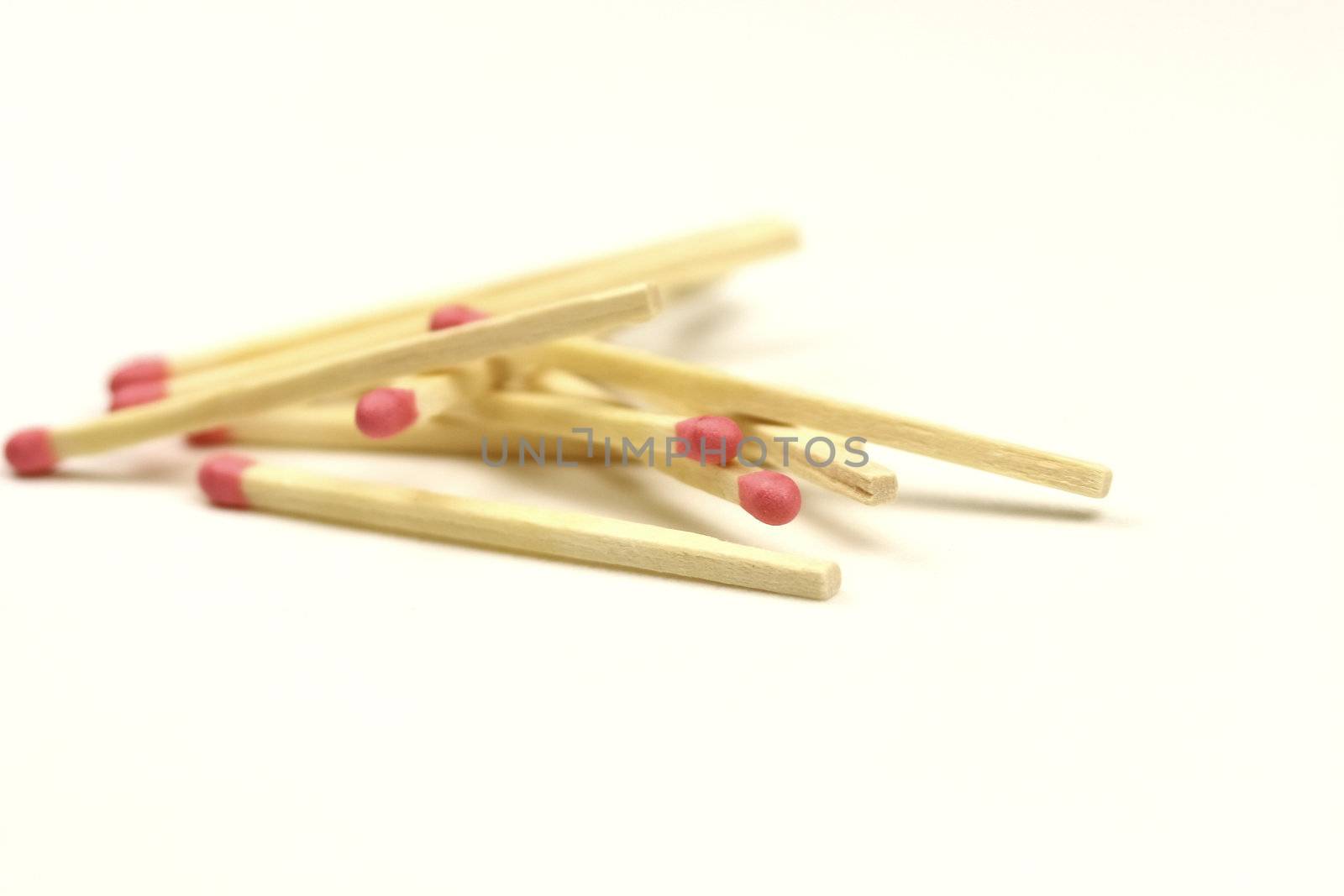 match sticks in a pile on white background