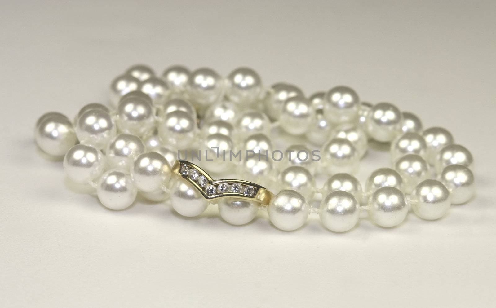 engagement rings and pearls by leafy