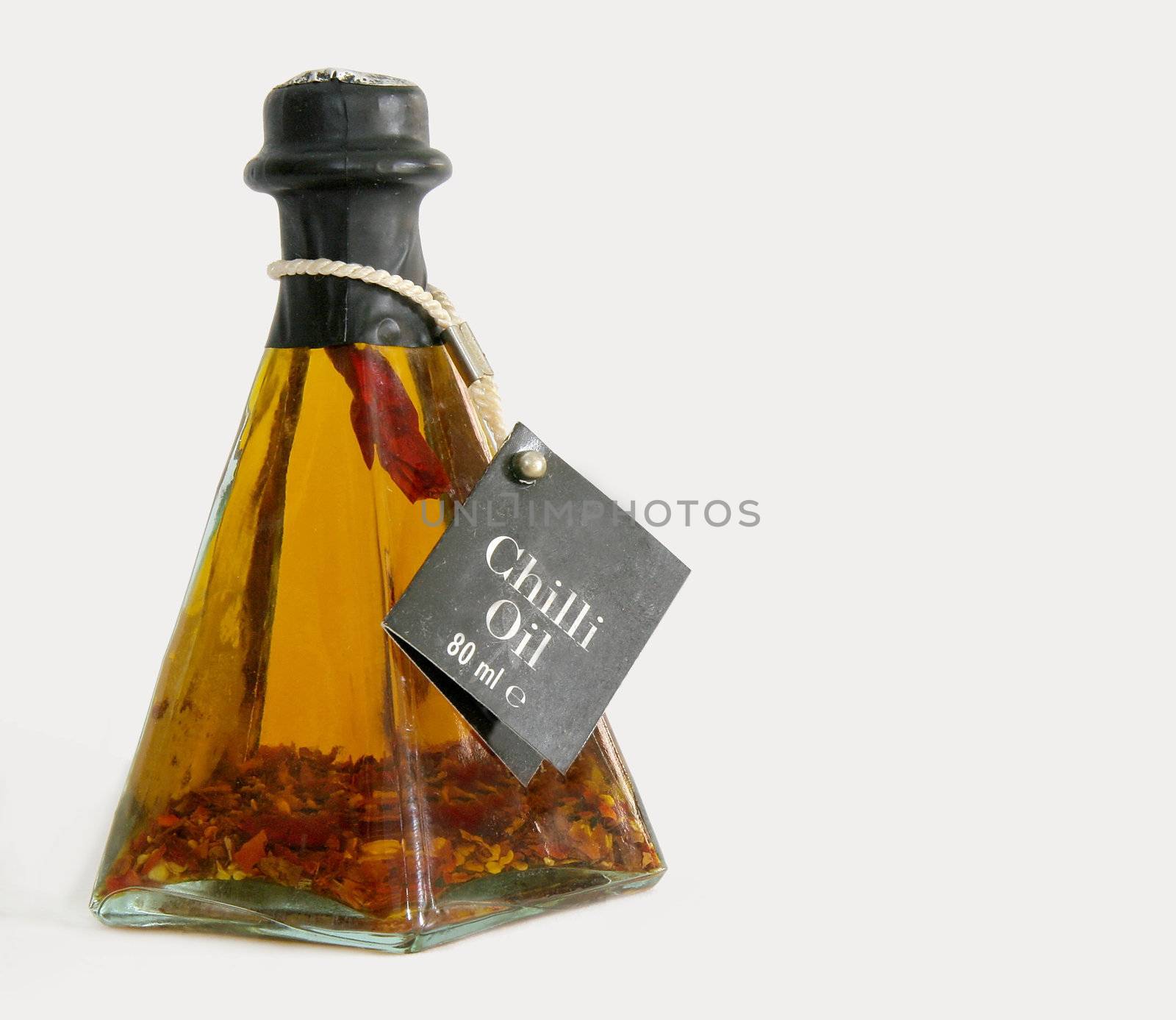 chilli oil in a pyramid shaped glass bottle