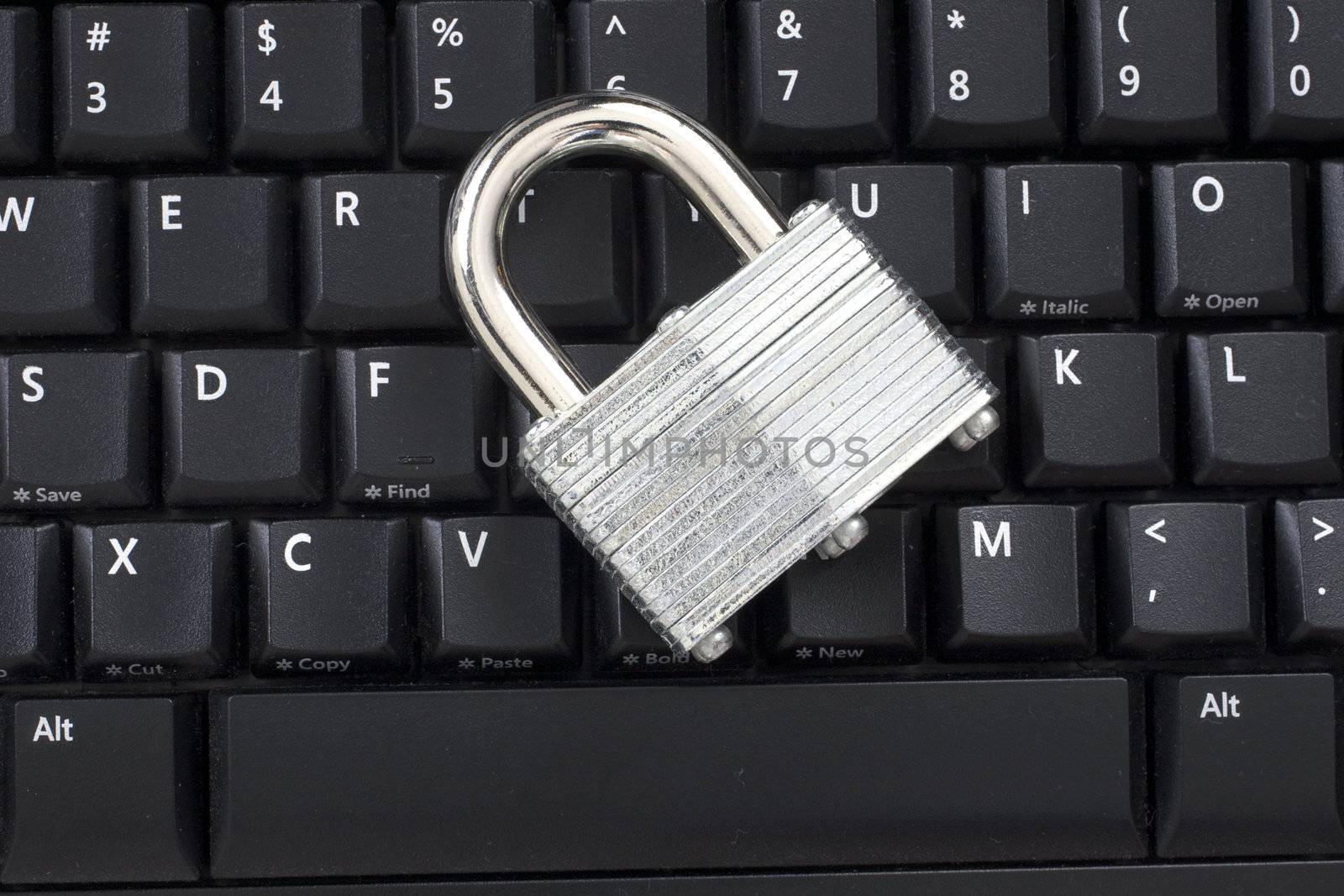 A Locked padlock on a keyboard representing Information Security