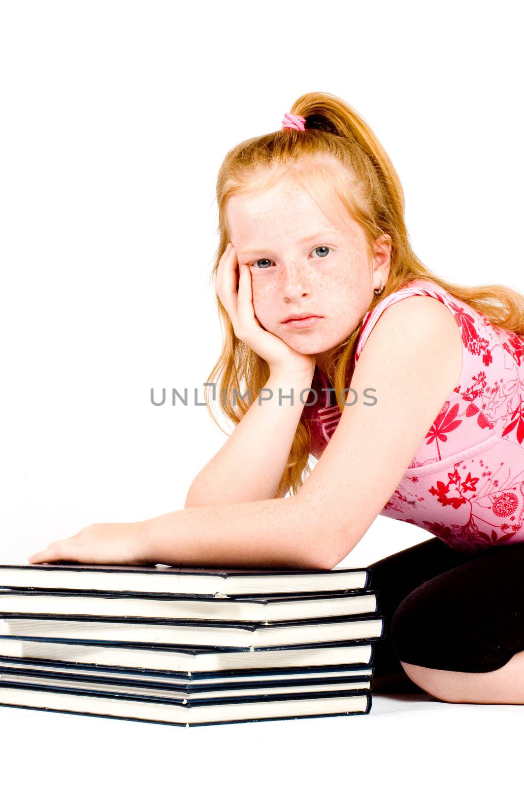 girl is tired after reading a stack of books isolated on a white background