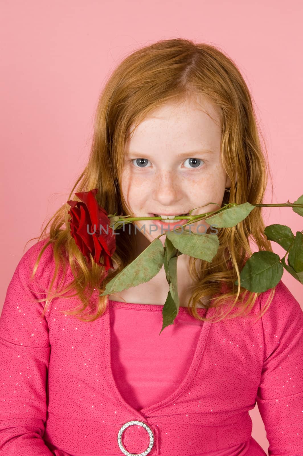 young girl is holding a red rose between her teeth by ladyminnie