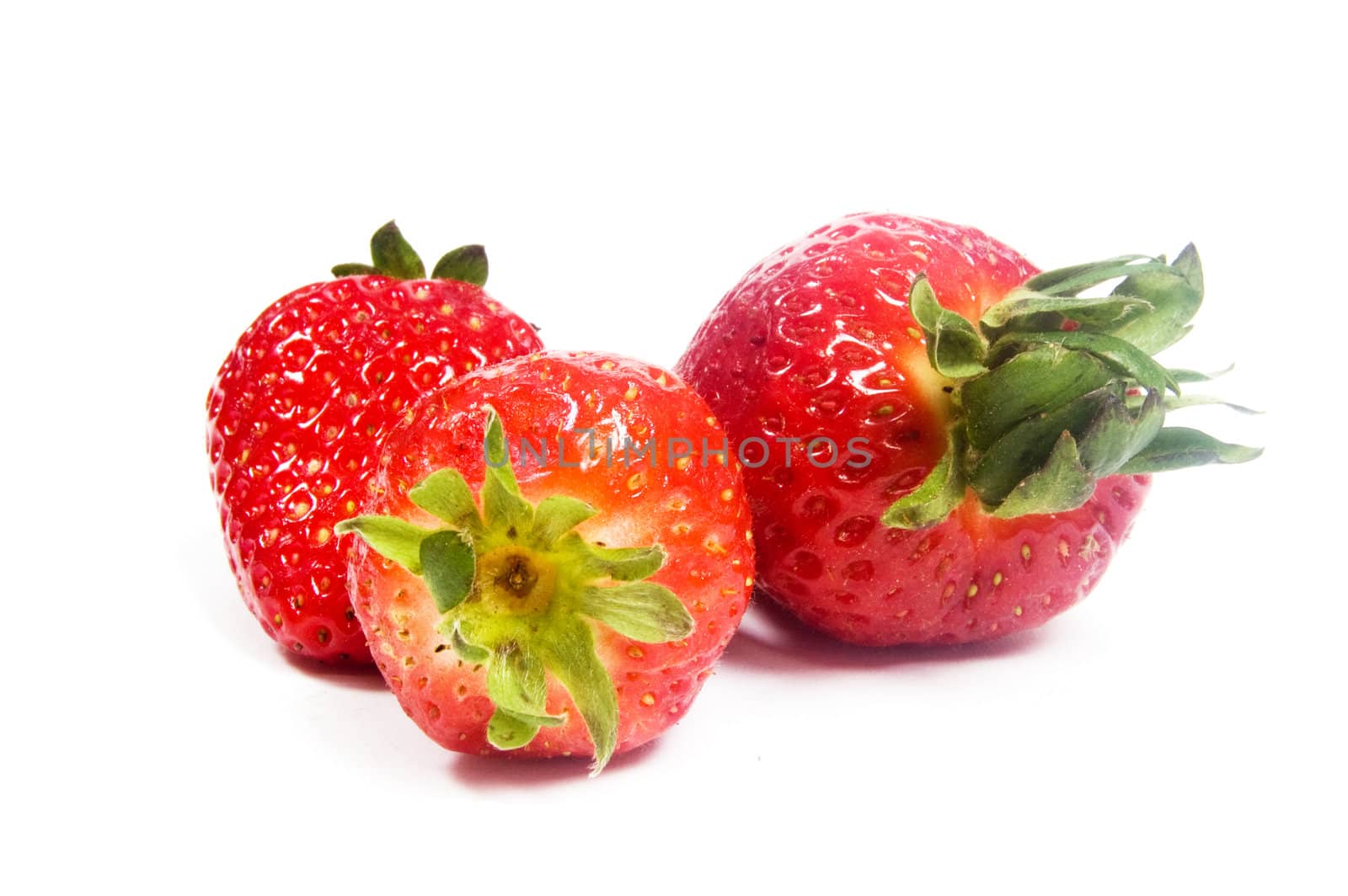 3 strawberries isolated on a white background