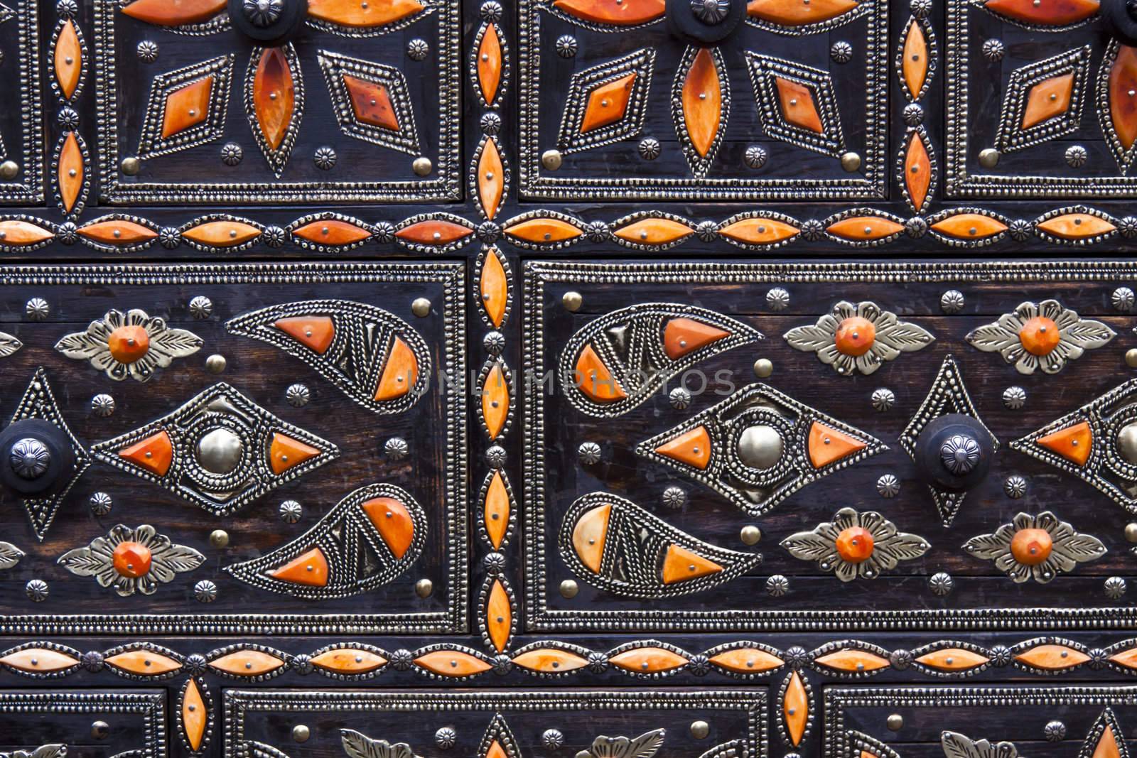 Detail of the wooden jewellery box decorated with the precious stones beeing sold at the traditional market of the oriental crafts.