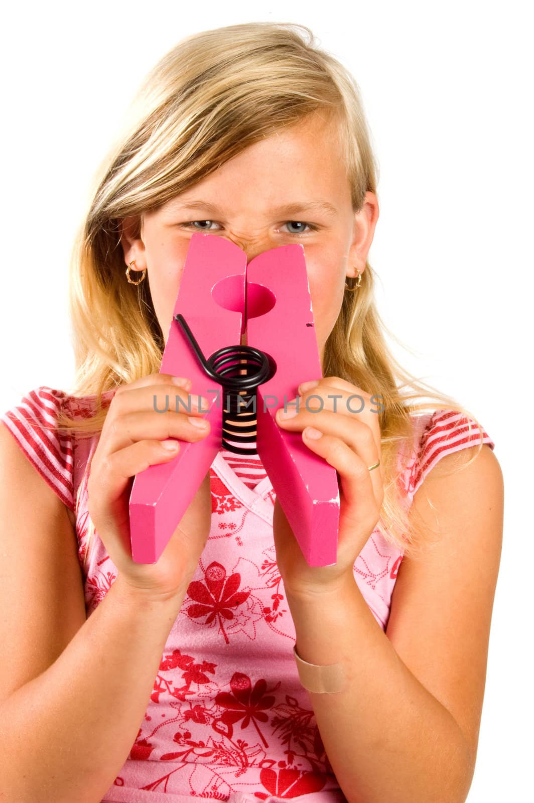 girl is smelling an unpleasant smell isolated on white