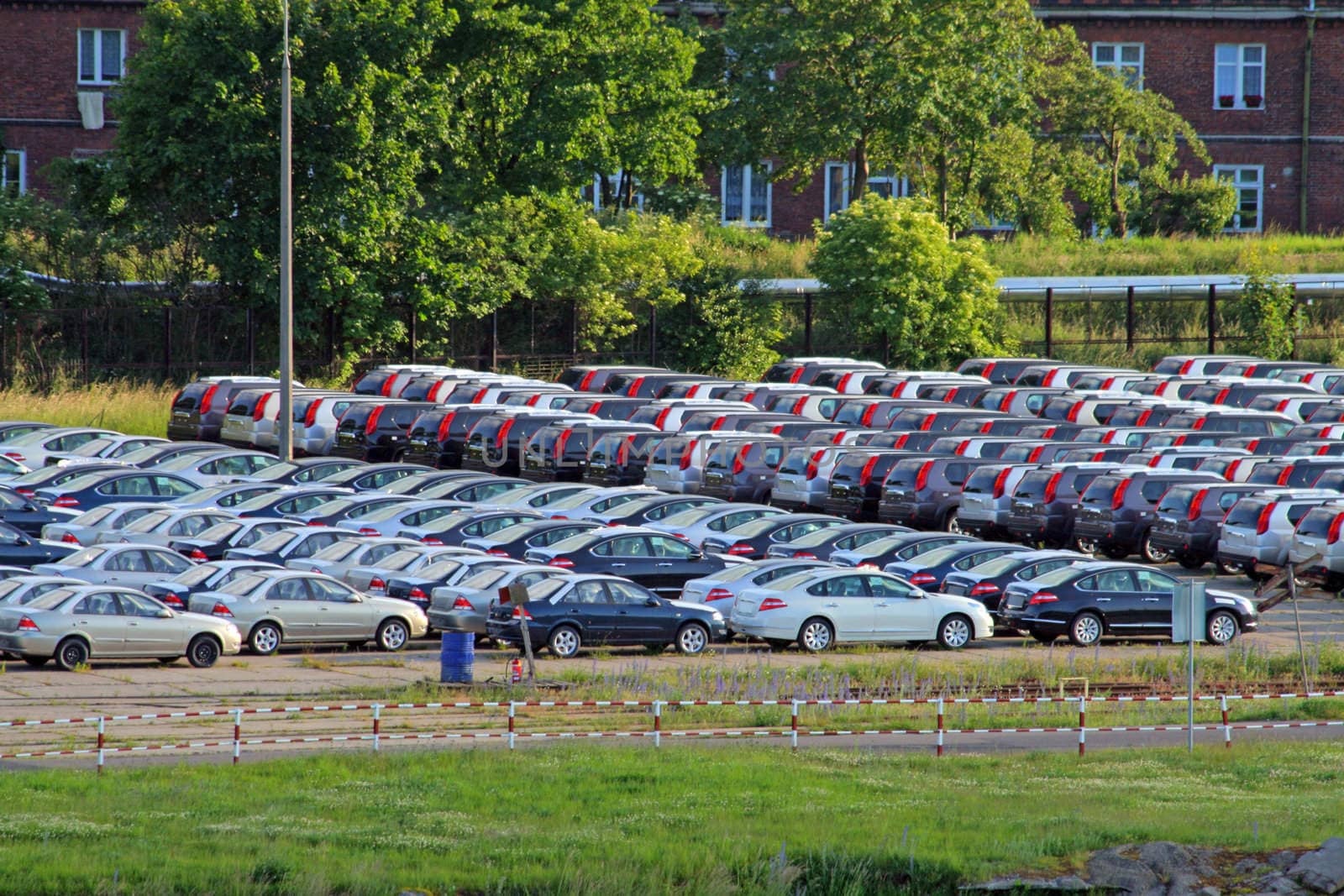 Parking at the harbour with lot of new cars to load, or unloaded from the ship
