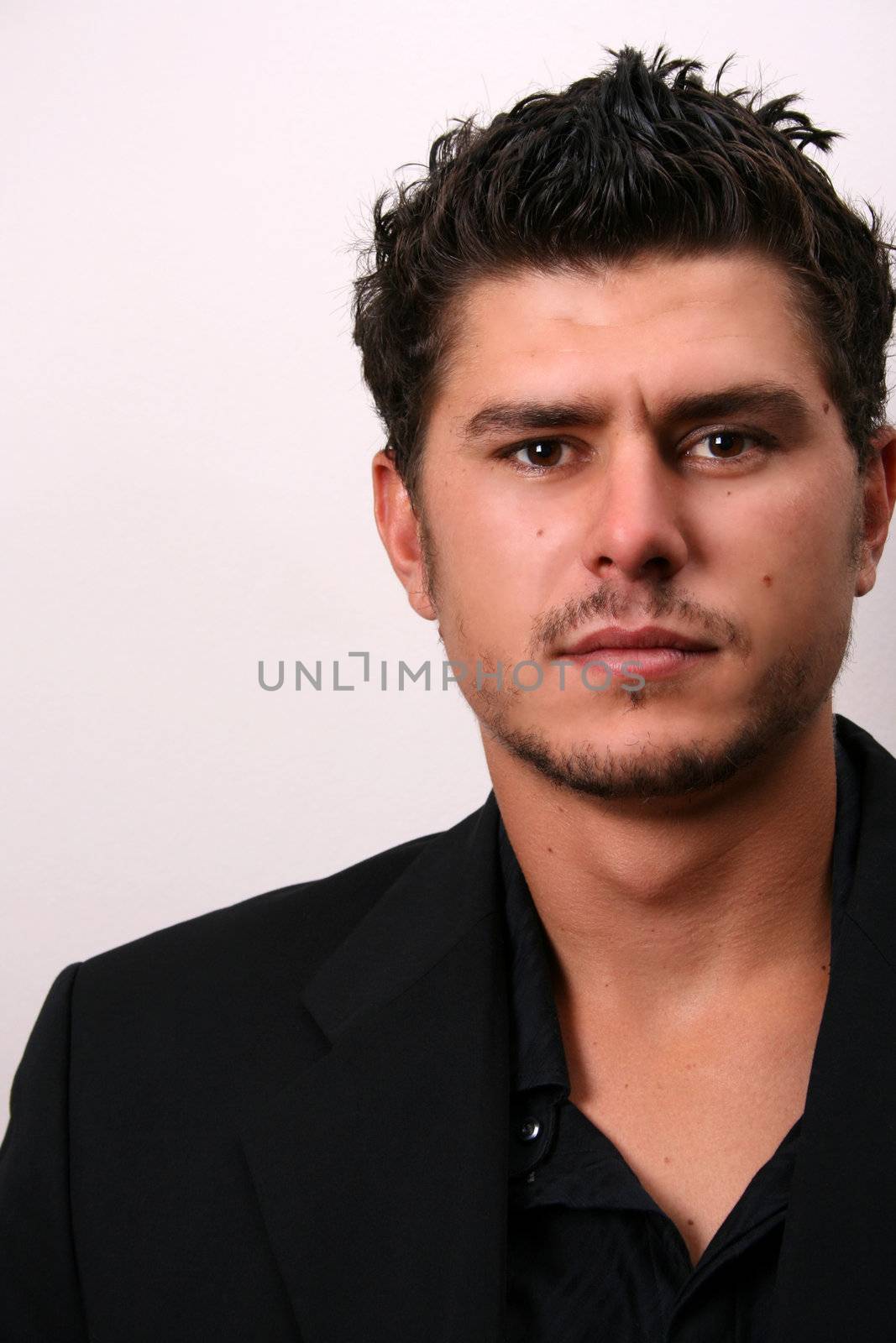 Male model in studio against white wall