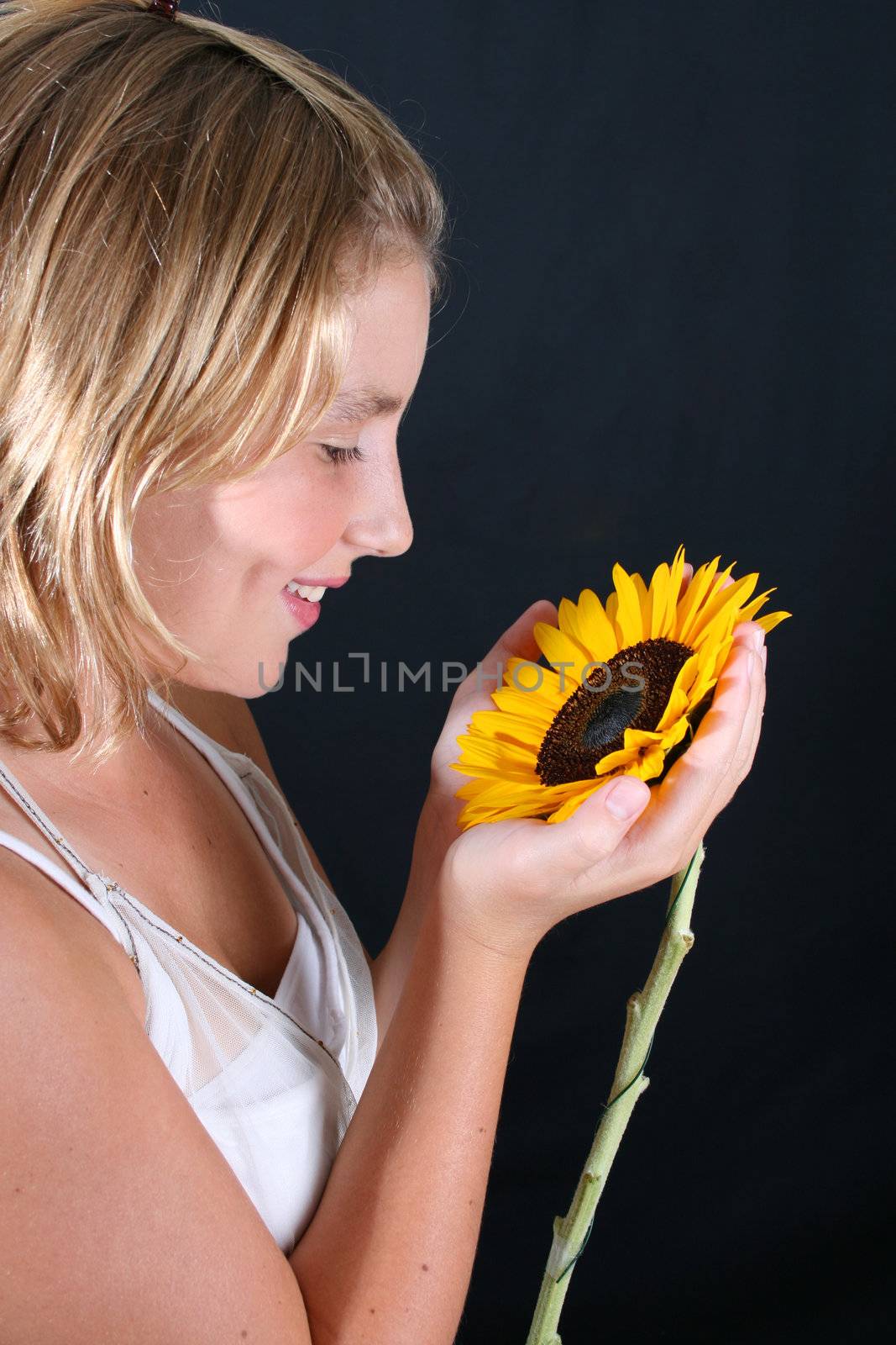 Teenage female model on a black background
