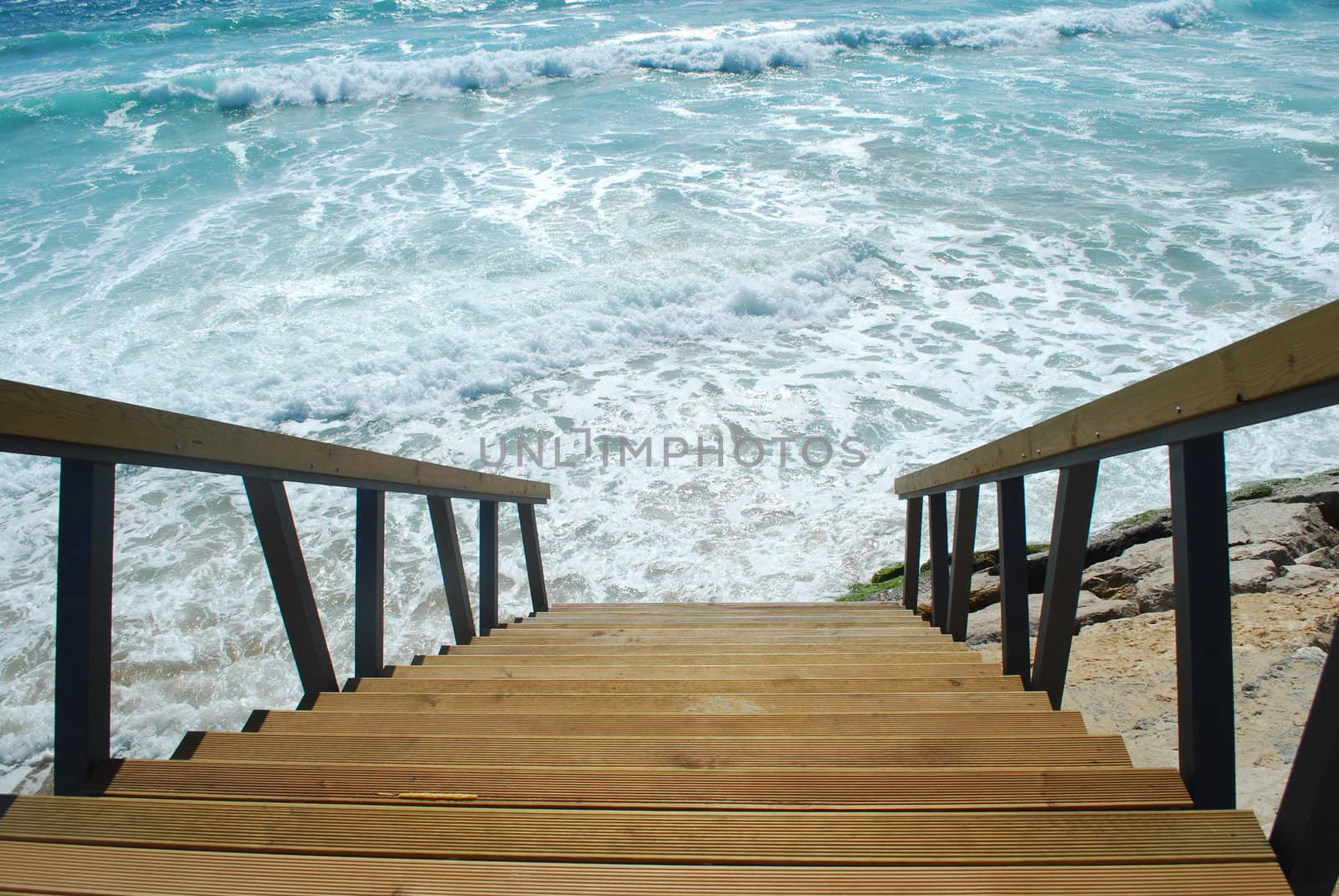 beautiful scene with stairs entering the ocean