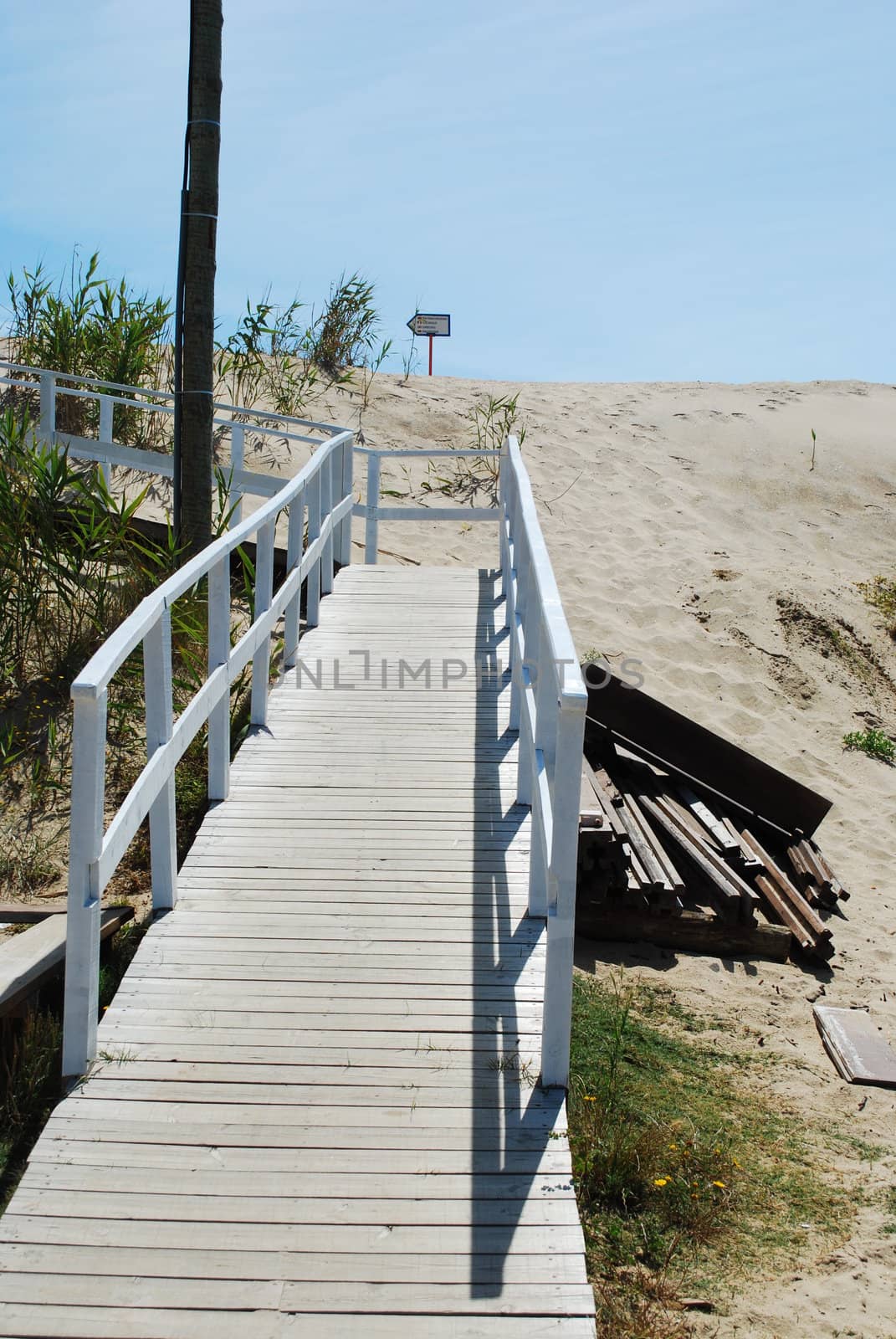 White boardwalk to local beach by luissantos84