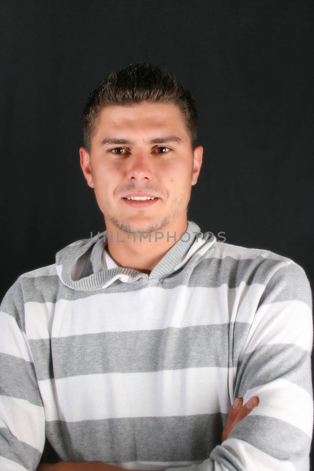 Male model in studio against black background