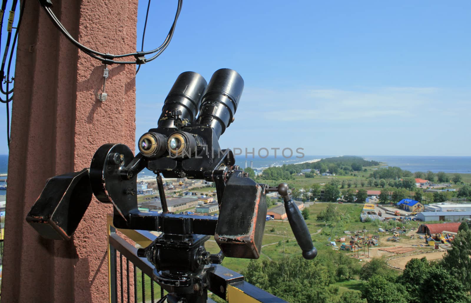 Binoculars and the aerial view of the "helski" peninsula, tombolo at Wladyslawowo, Poland
