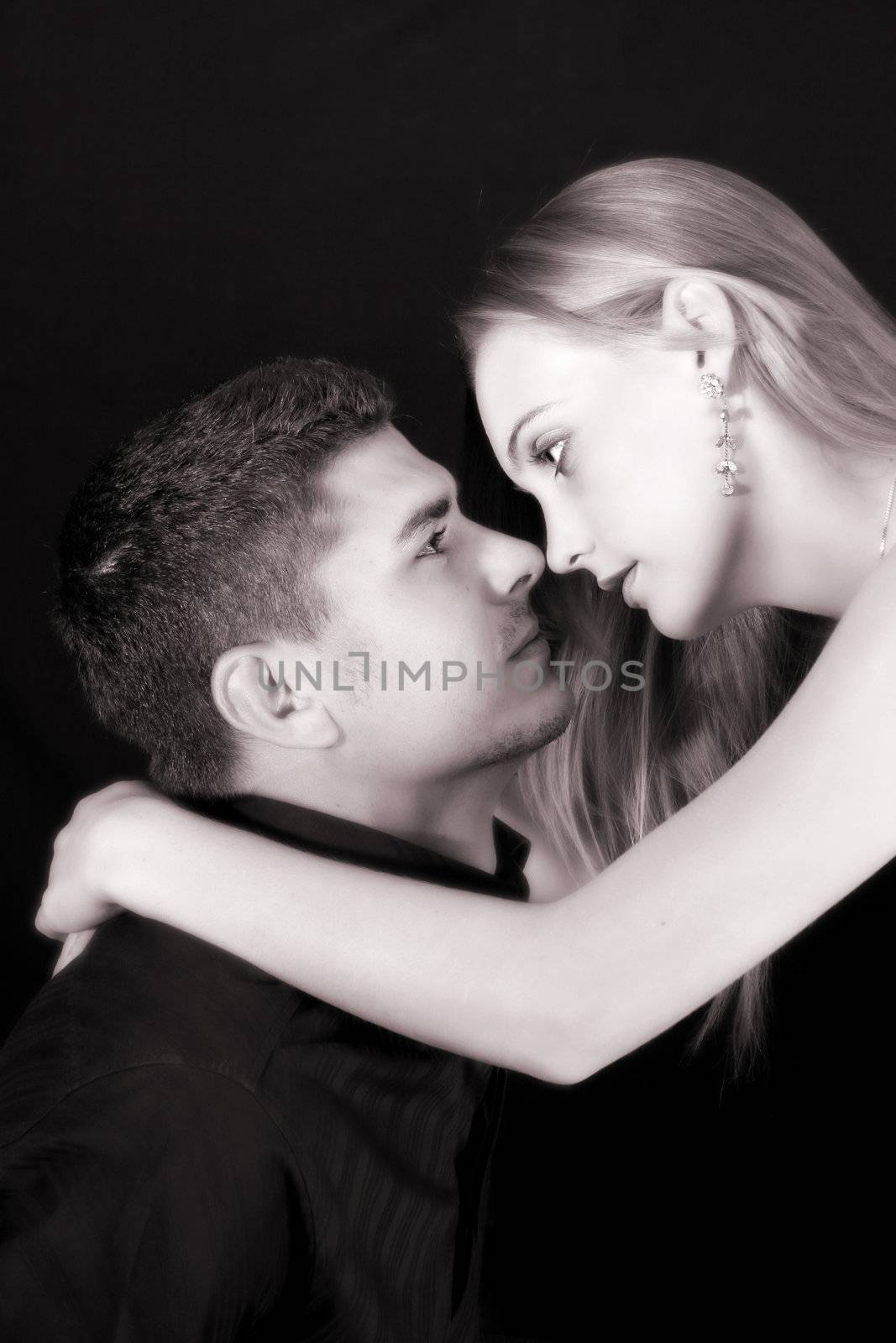 Young couple in love, faces close to one another