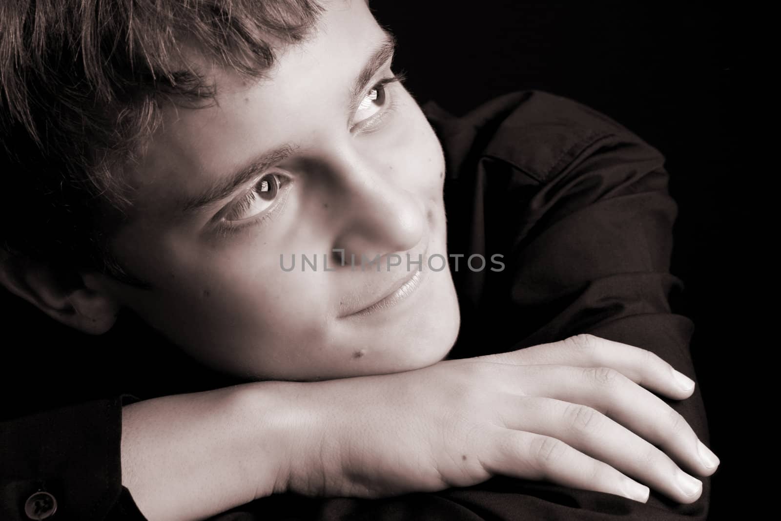 Teenage male in casual attire looking into the distance