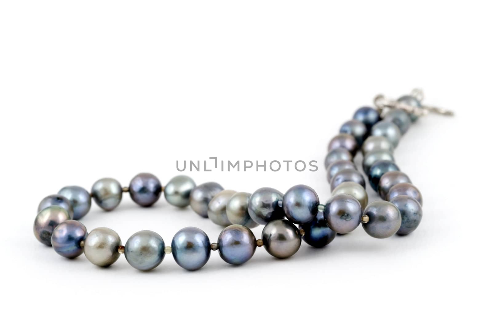 A beautiful necklace made of pearls of the Andaman sea of the coast of Thailand, on a white background. Adobe RGB color profile.
