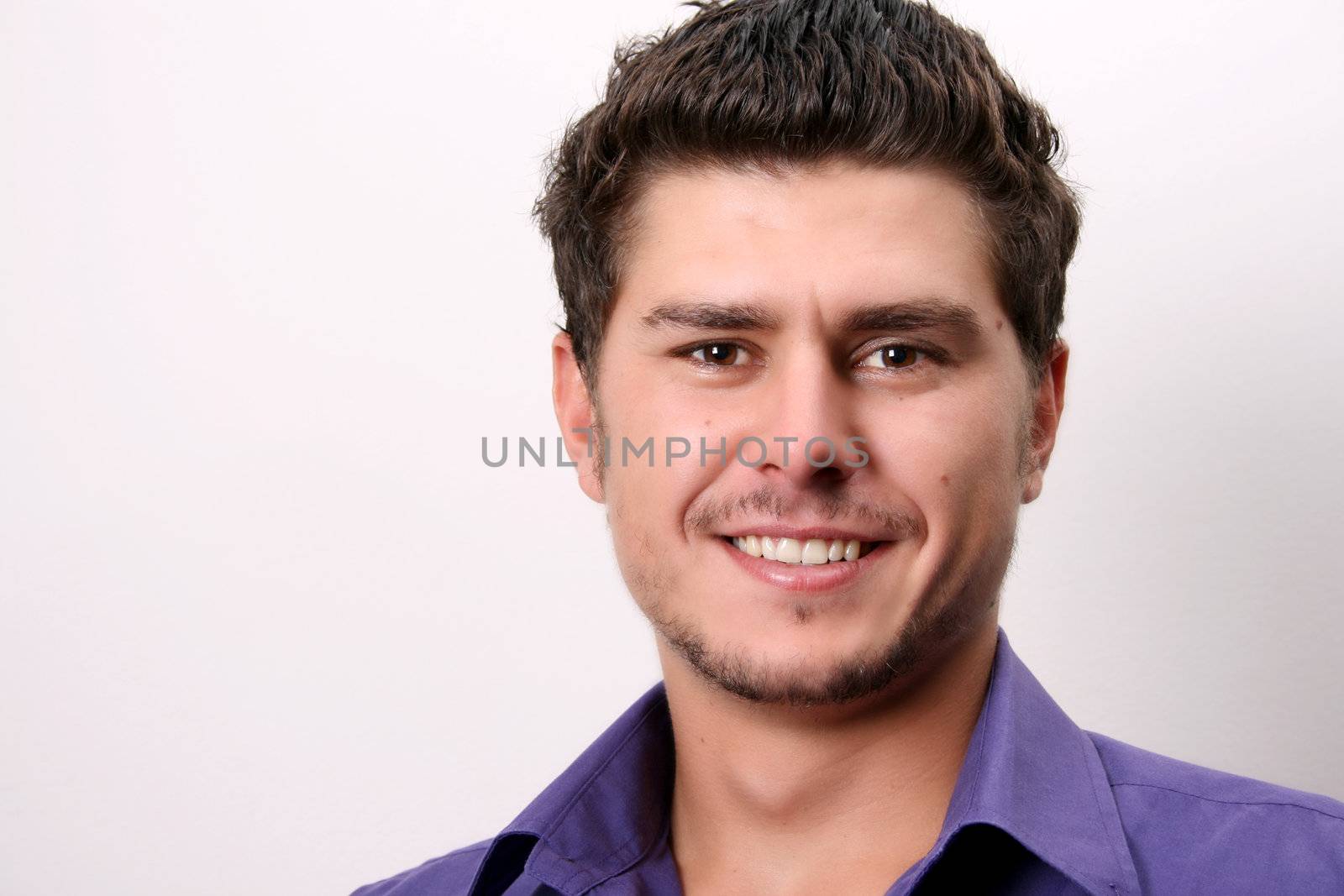 Male model in studio against white wall