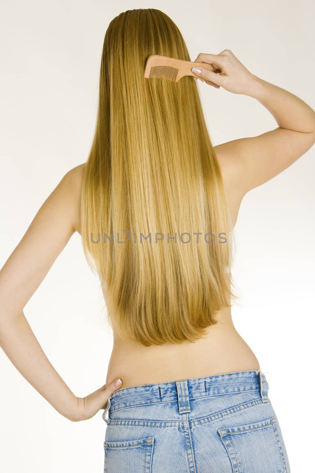  combing woman wearing jeans 